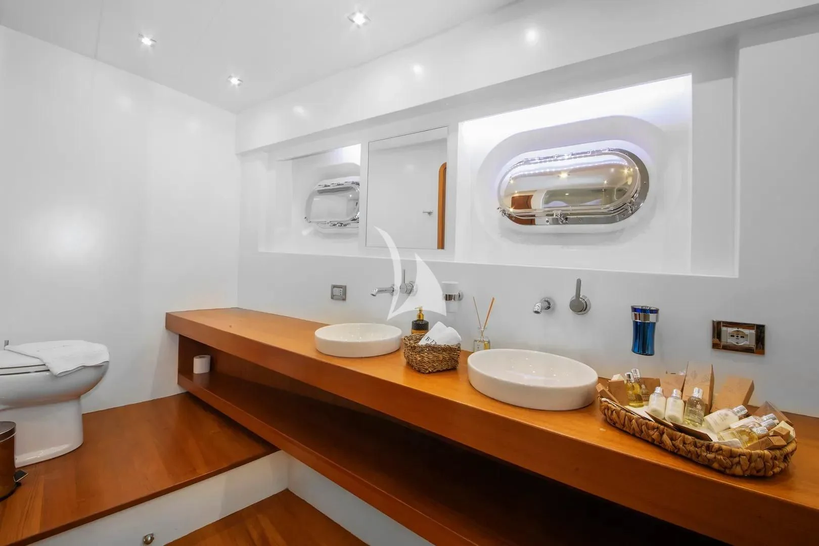 a kitchen with white cabinets aboard UBI BENE Yacht for Charter