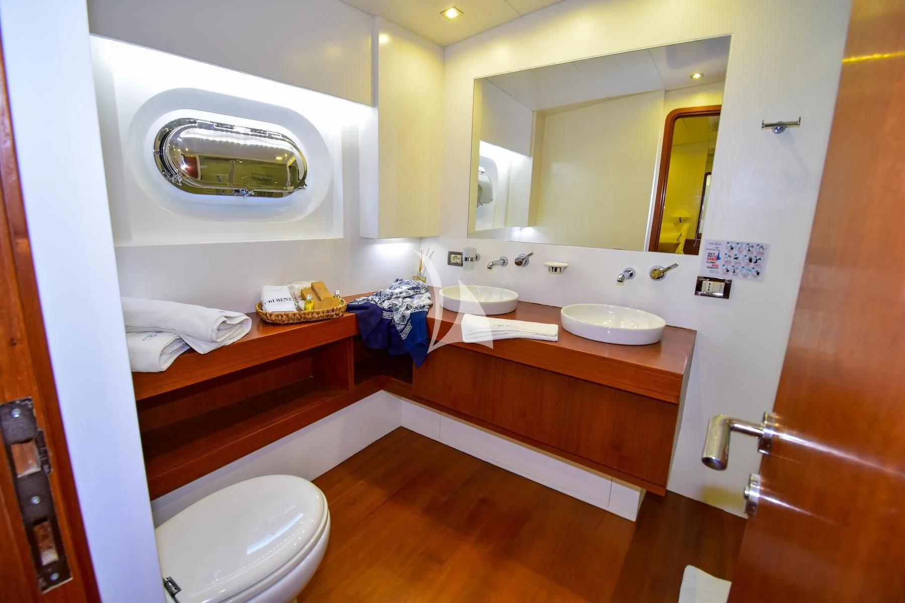 a bathroom with a sink and toilet aboard UBI BENE Yacht for Charter