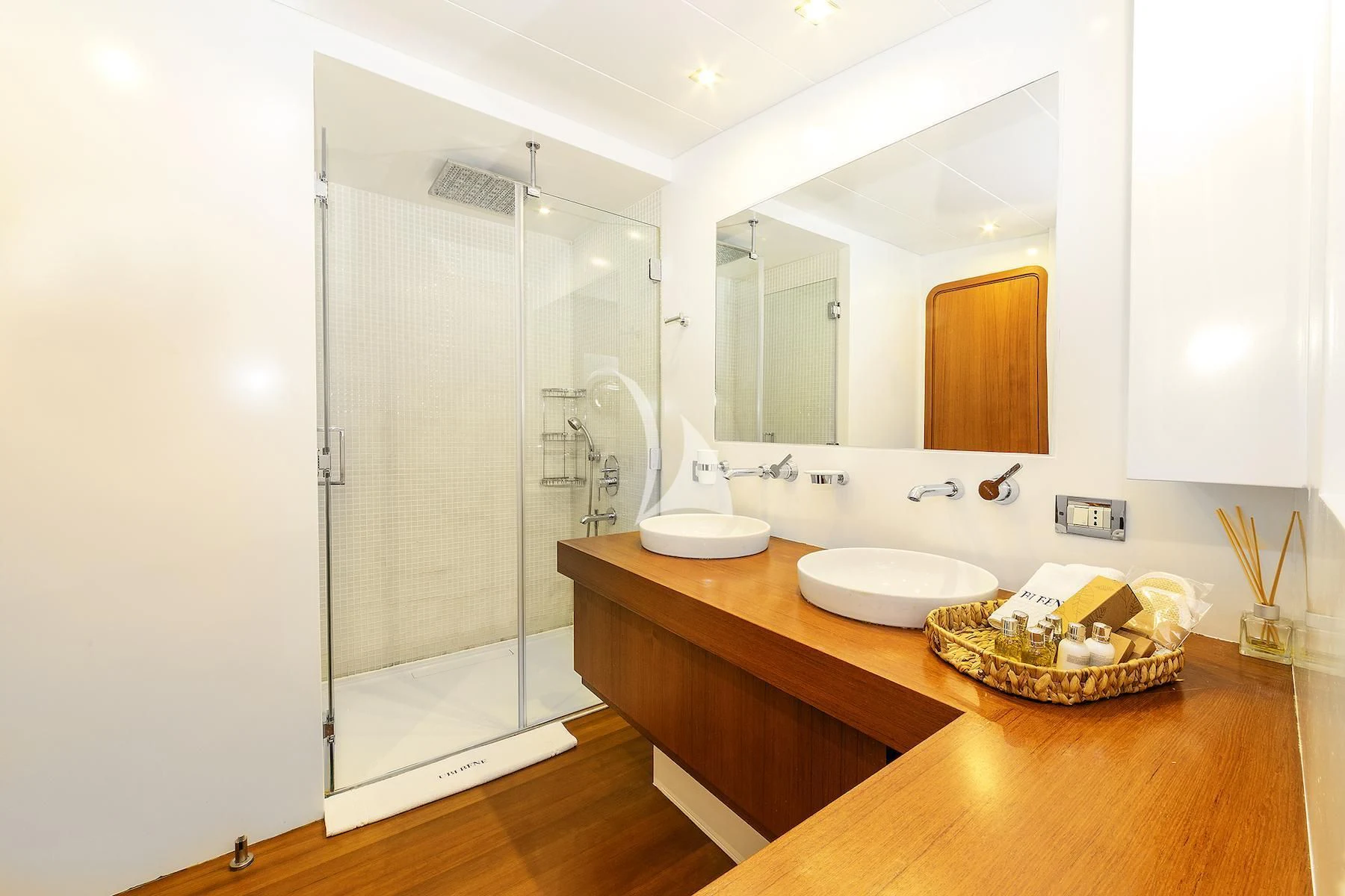 a bathroom with a large mirror aboard UBI BENE Yacht for Charter