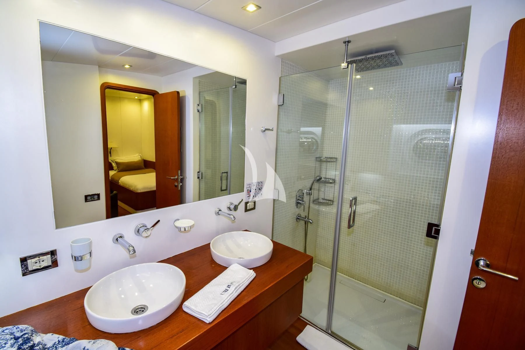 a bathroom with a sink and a shower aboard UBI BENE Yacht for Charter