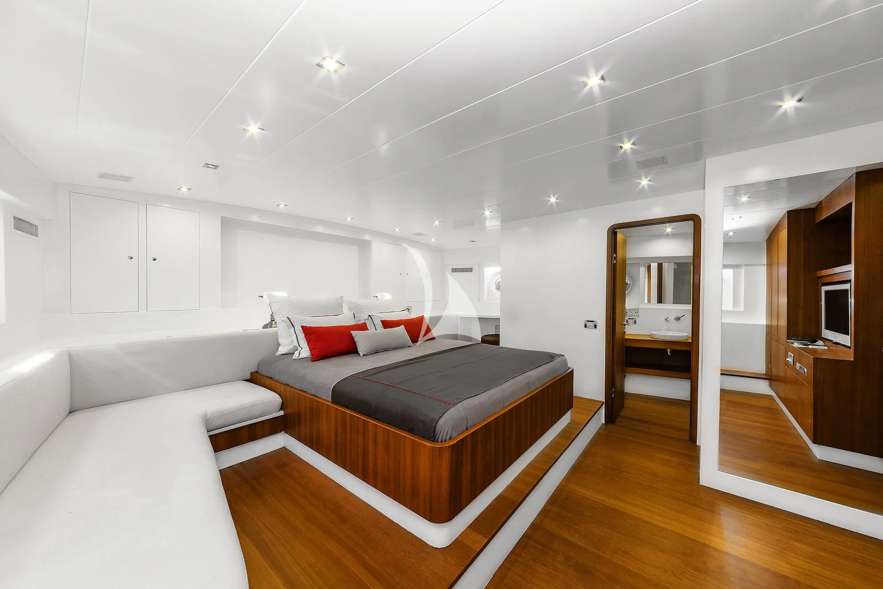 a room with a bed and a couch aboard UBI BENE Yacht for Charter