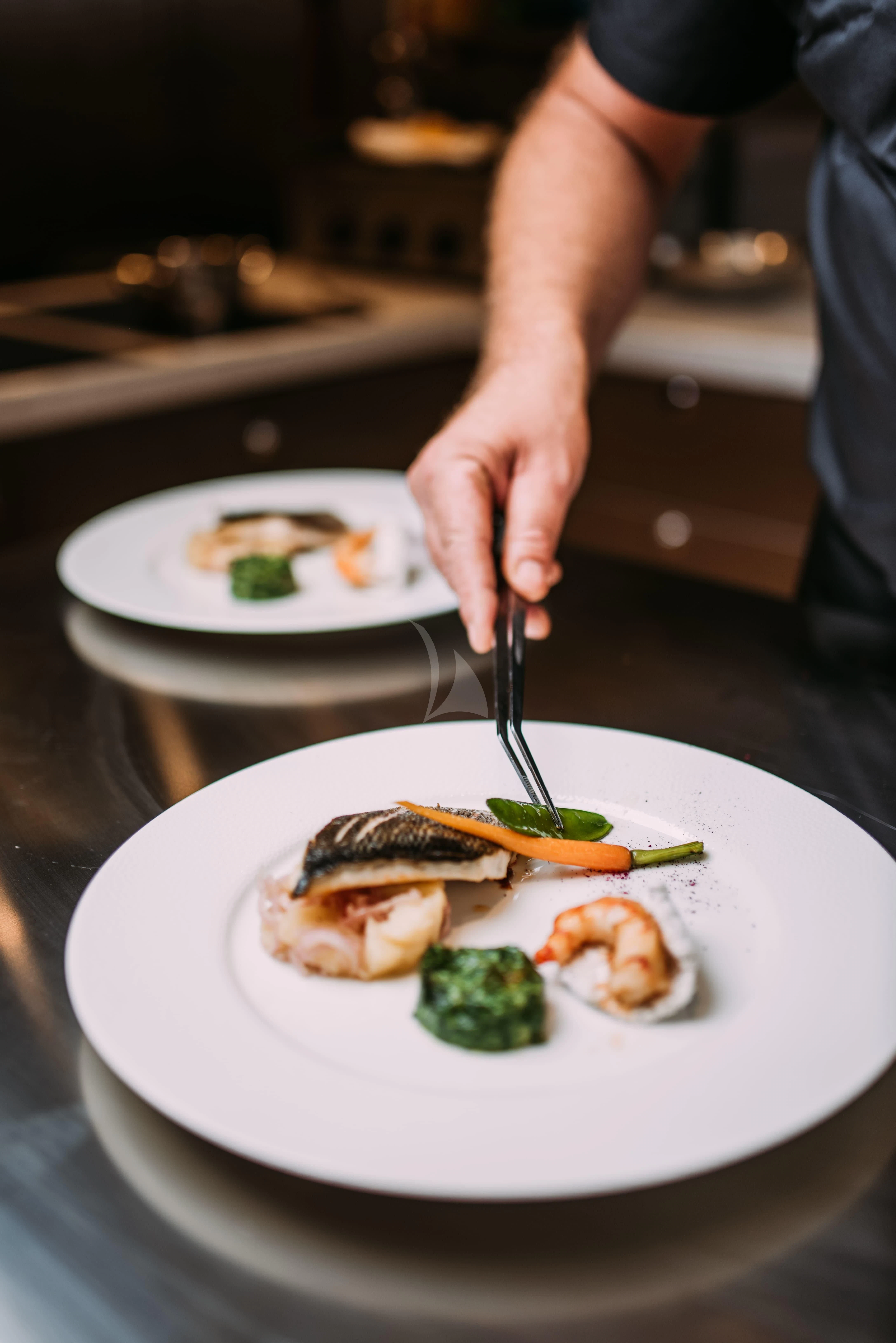a person eating food aboard TIREA Yacht for Sale