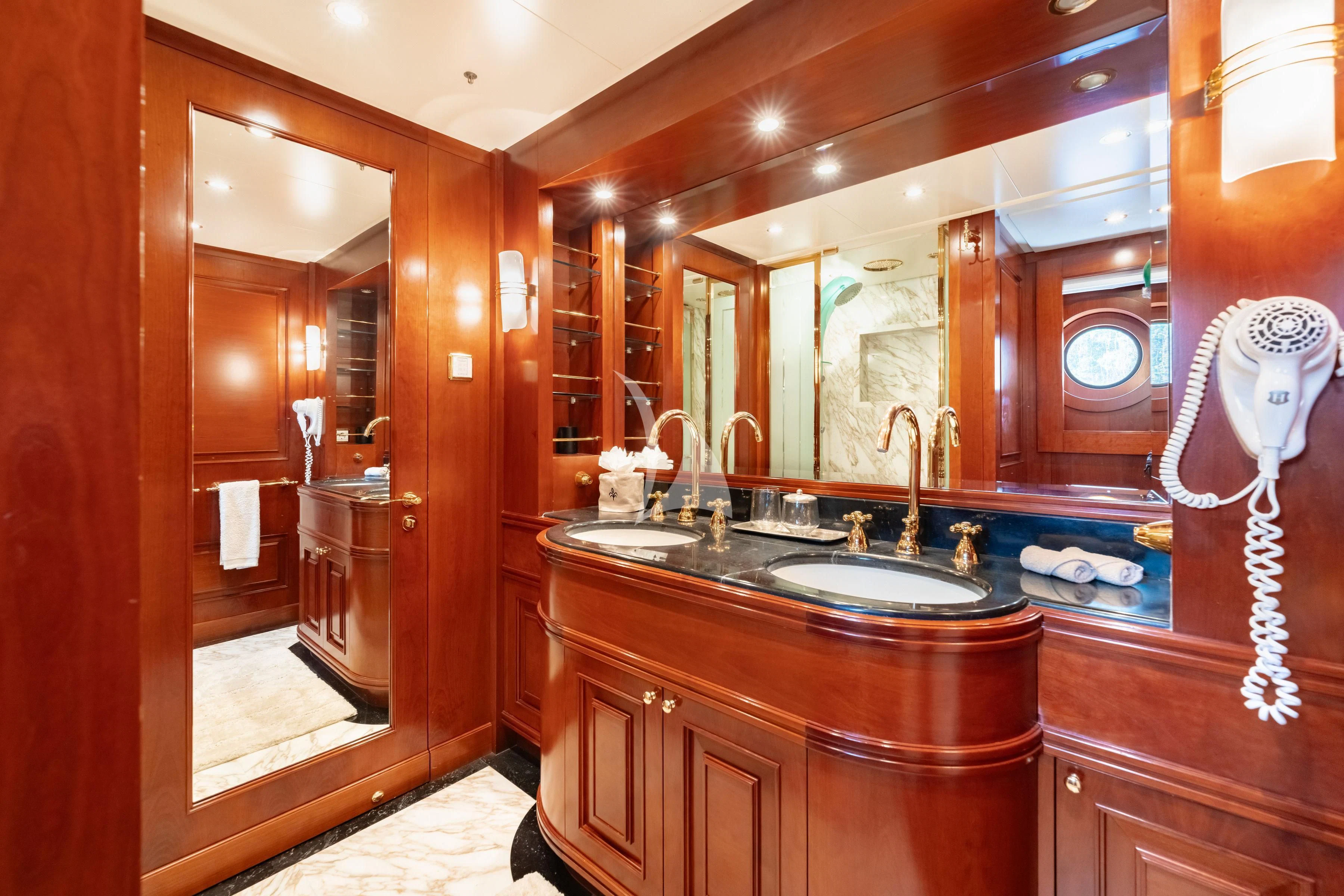 a bathroom with a sink and a fan aboard TIREA Yacht for Sale