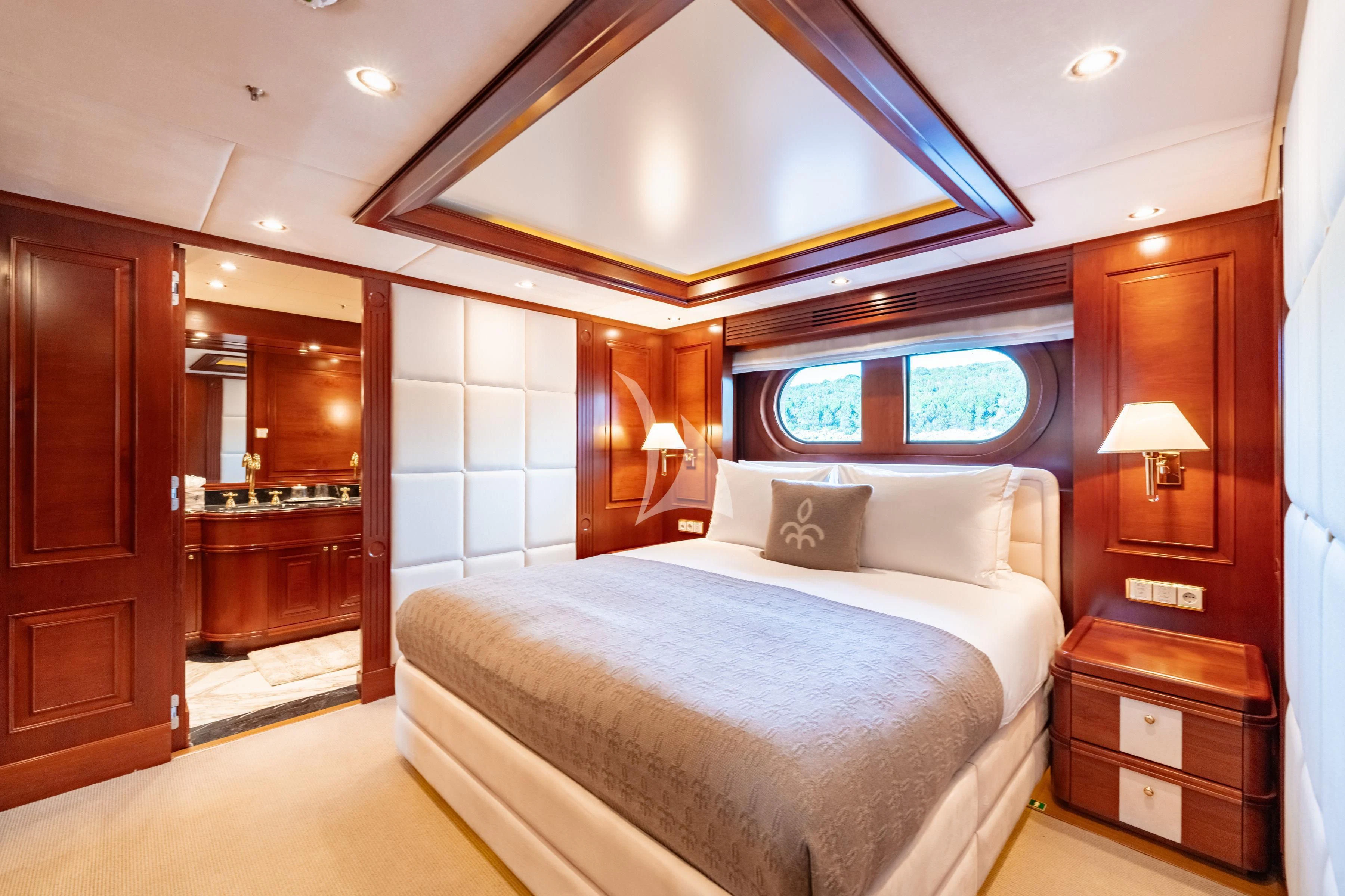 a bedroom with a large bed aboard TIREA Yacht for Sale