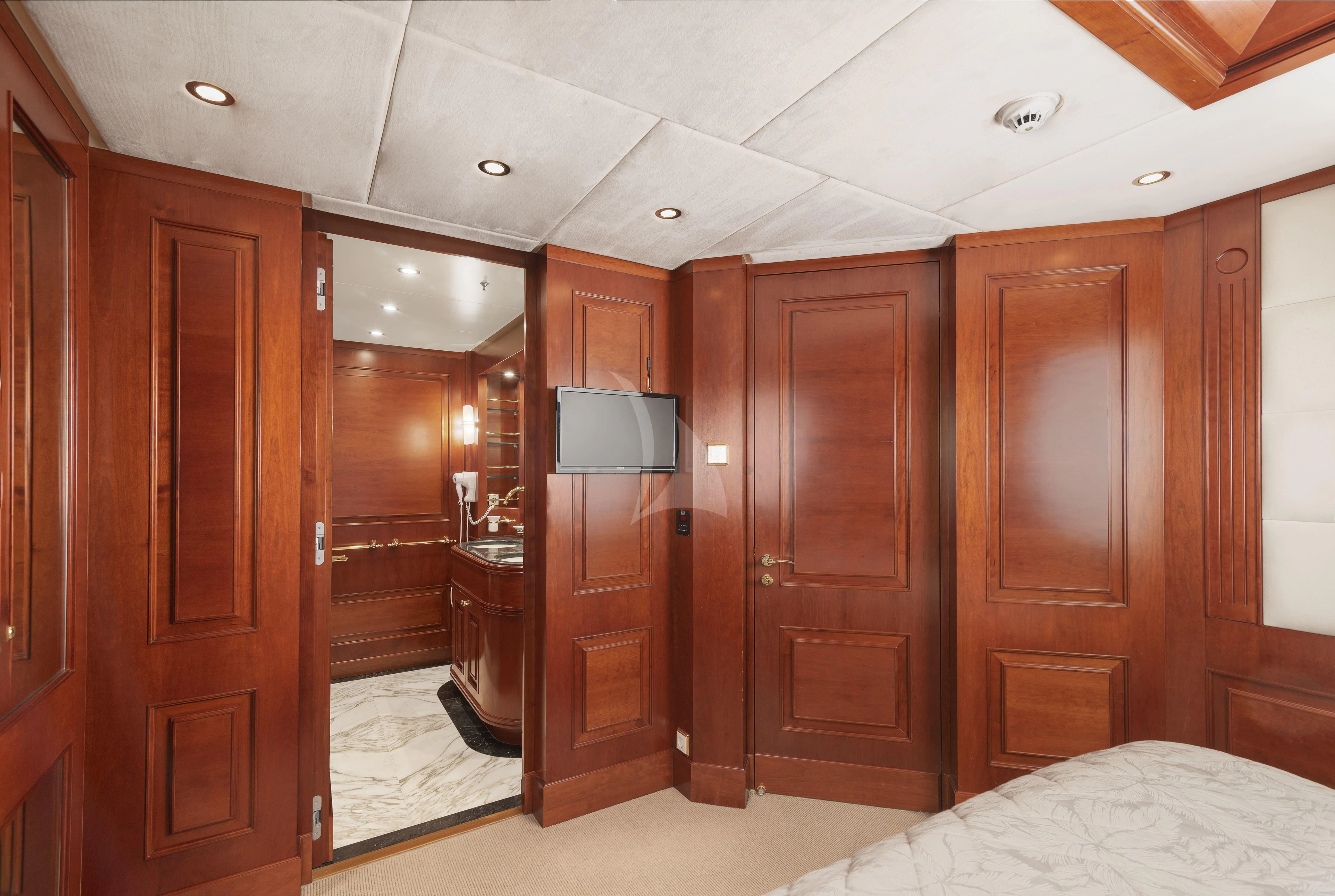 a room with wooden cabinets aboard TIREA Yacht for Sale