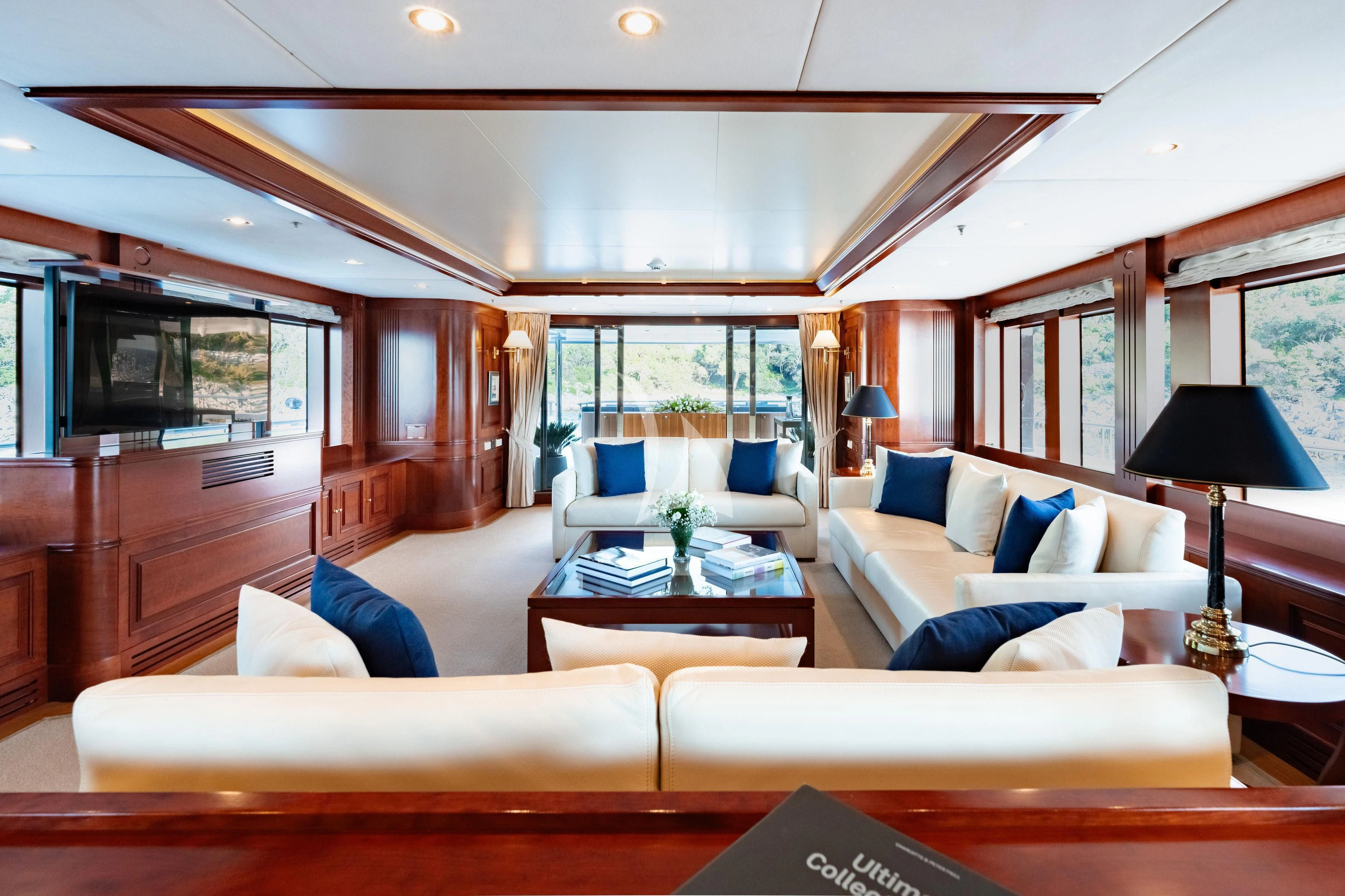 a living room with a couch and a coffee table aboard TIREA Yacht for Sale