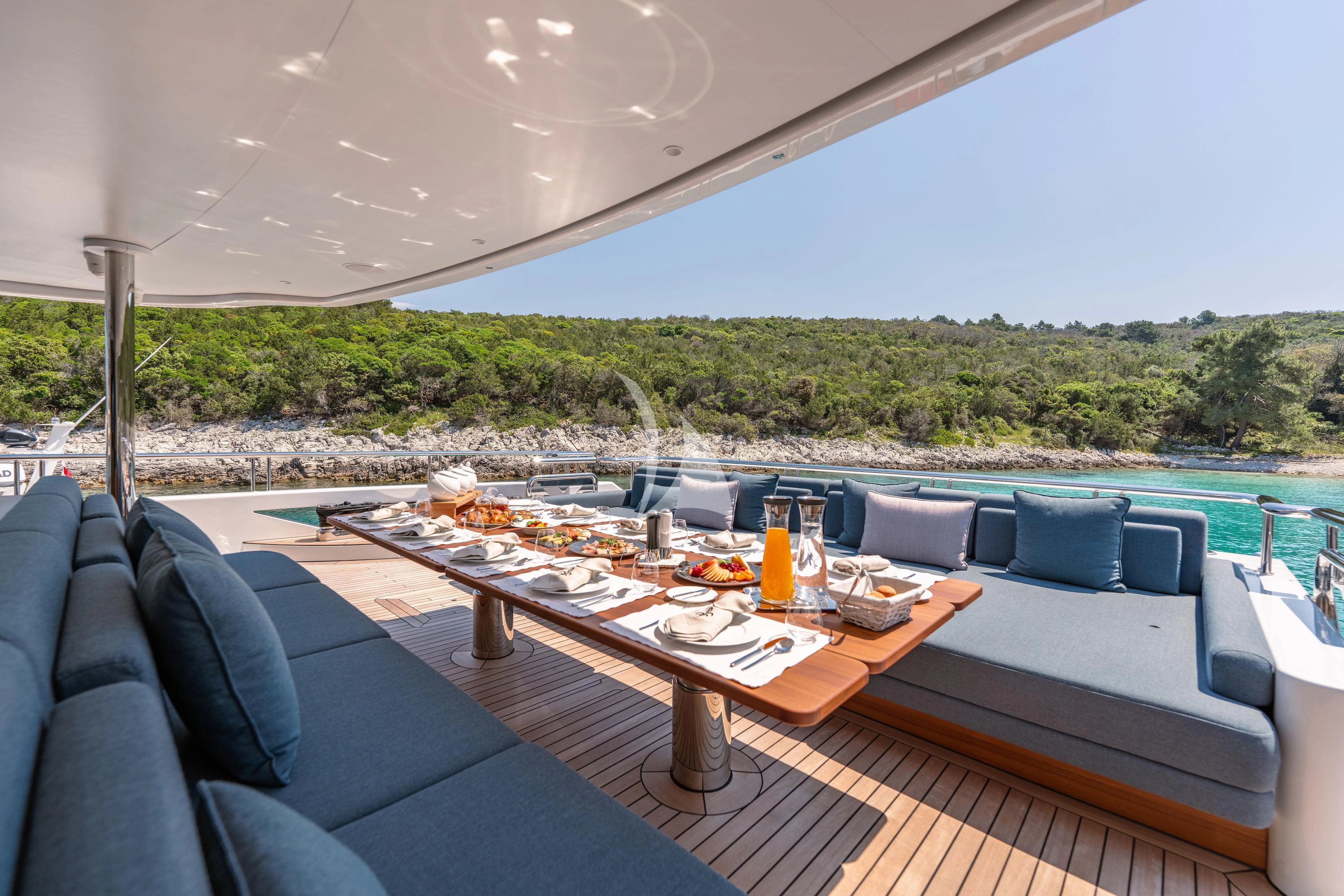 a table on a deck aboard TIREA Yacht for Sale