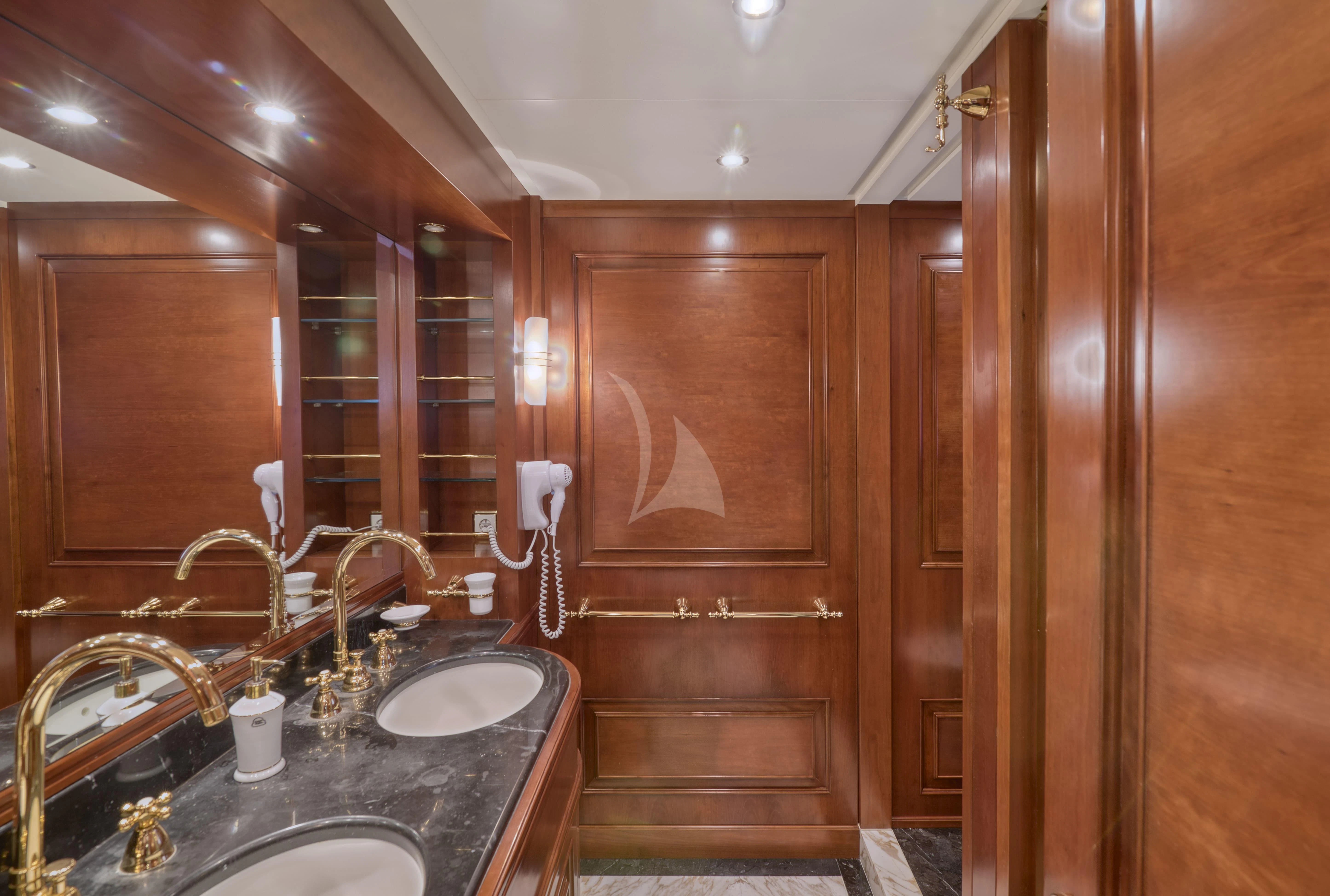 a bathroom with a sink and a mirror aboard TIREA Yacht for Sale