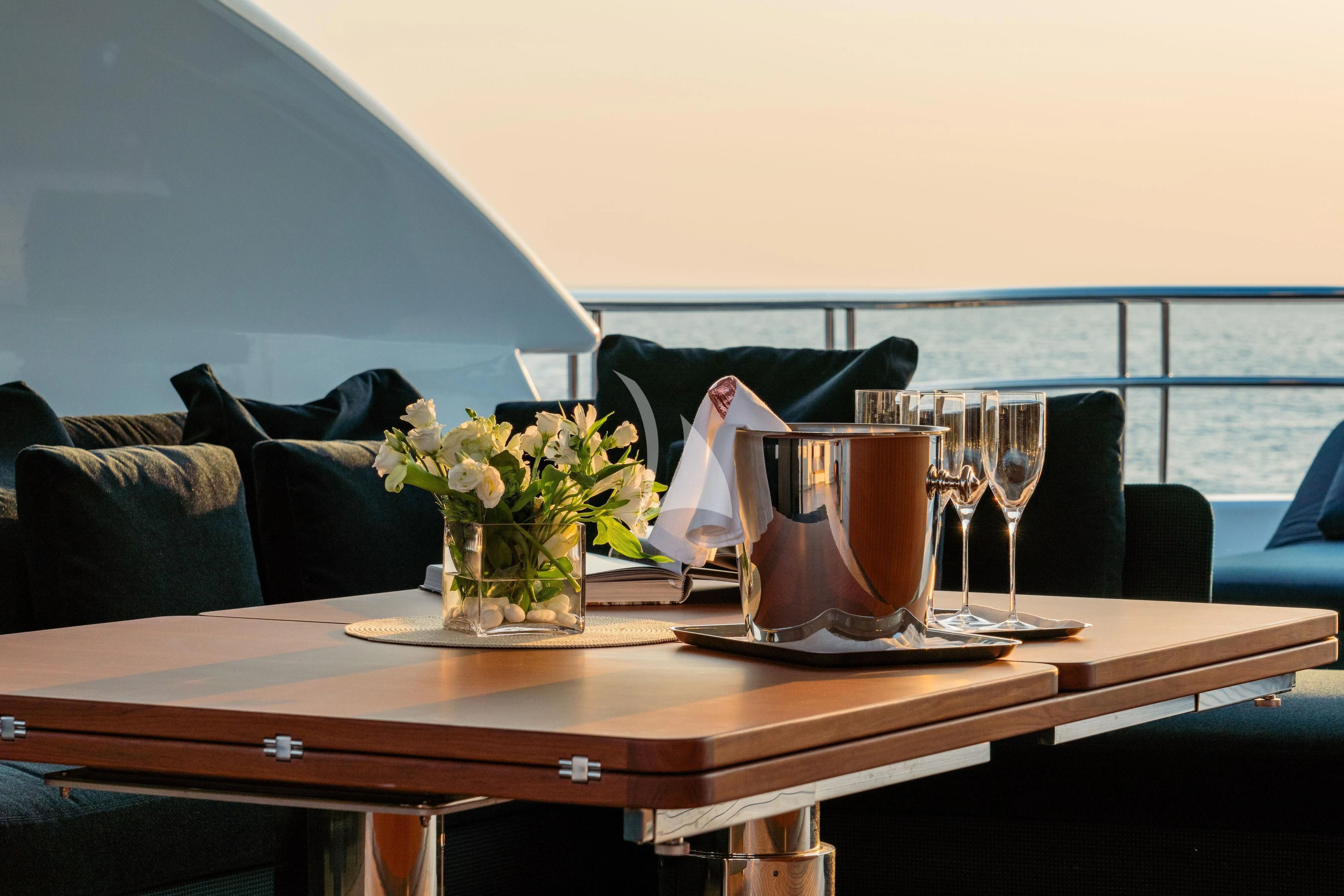 a table with a vase of flowers on it aboard TIREA Yacht for Sale