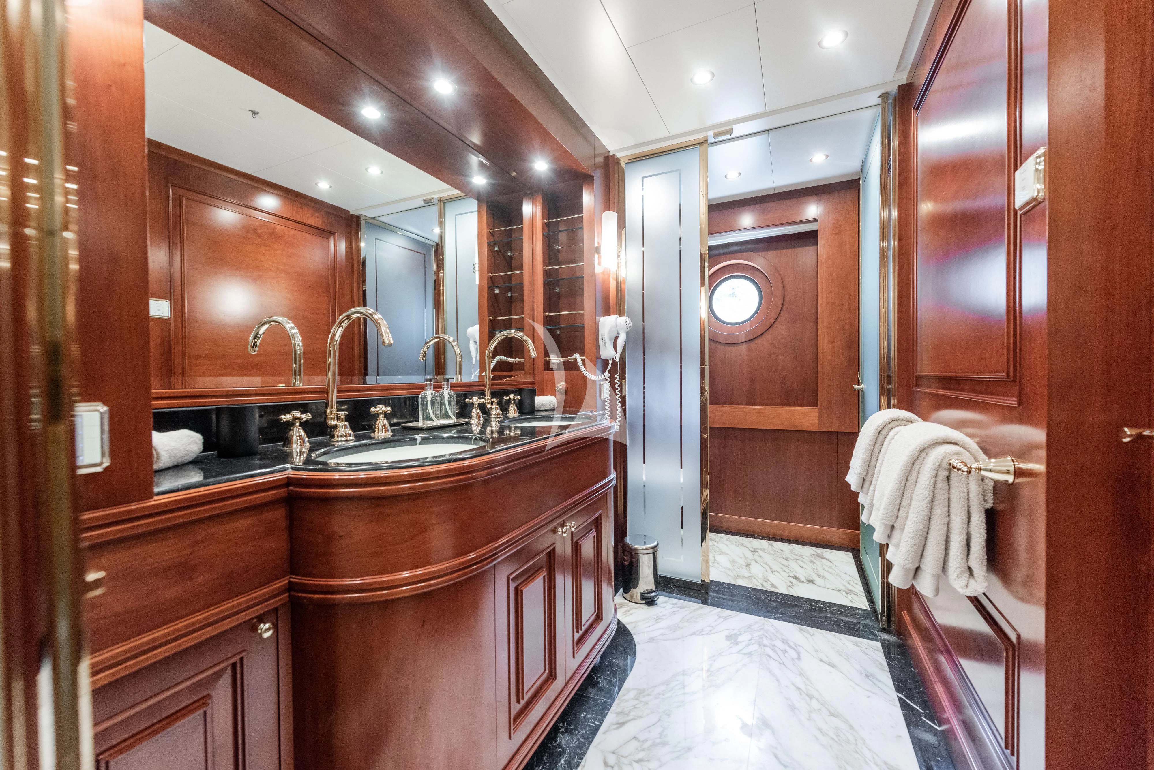 a bathroom with a sink and a mirror aboard TIREA Yacht for Sale