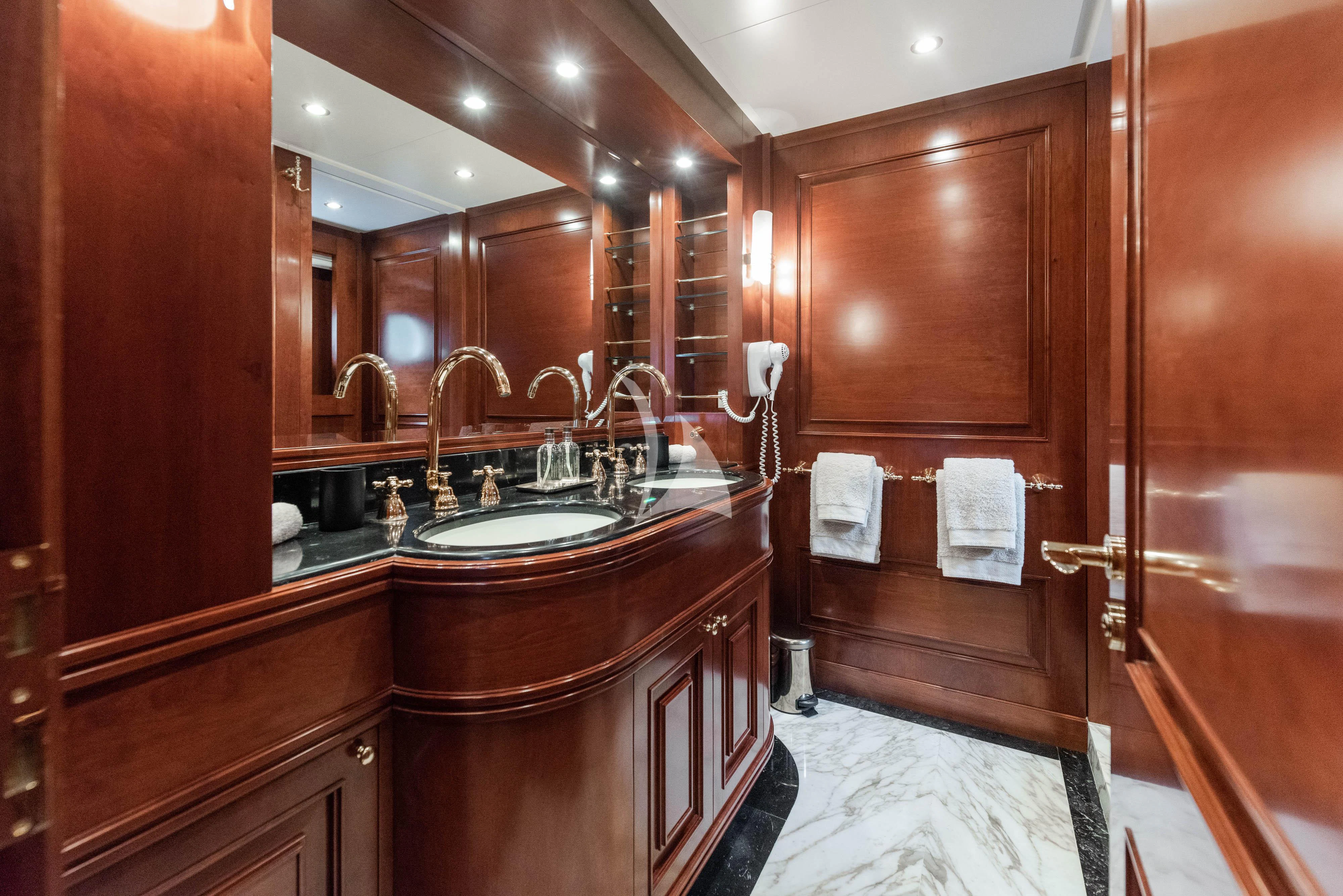 a bathroom with a sink and a mirror aboard TIREA Yacht for Sale