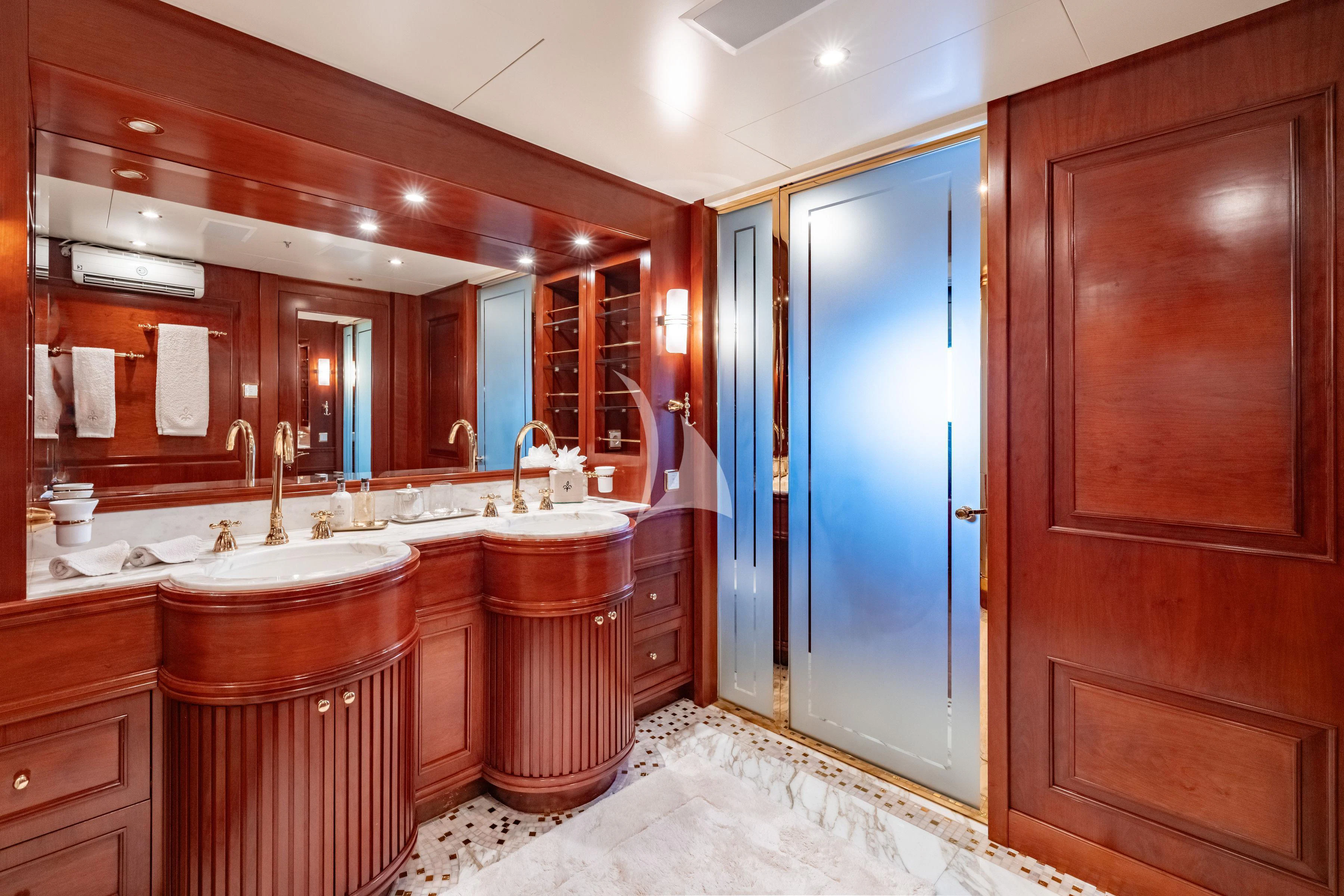 a bathroom with a sink and cabinets aboard TIREA Yacht for Sale