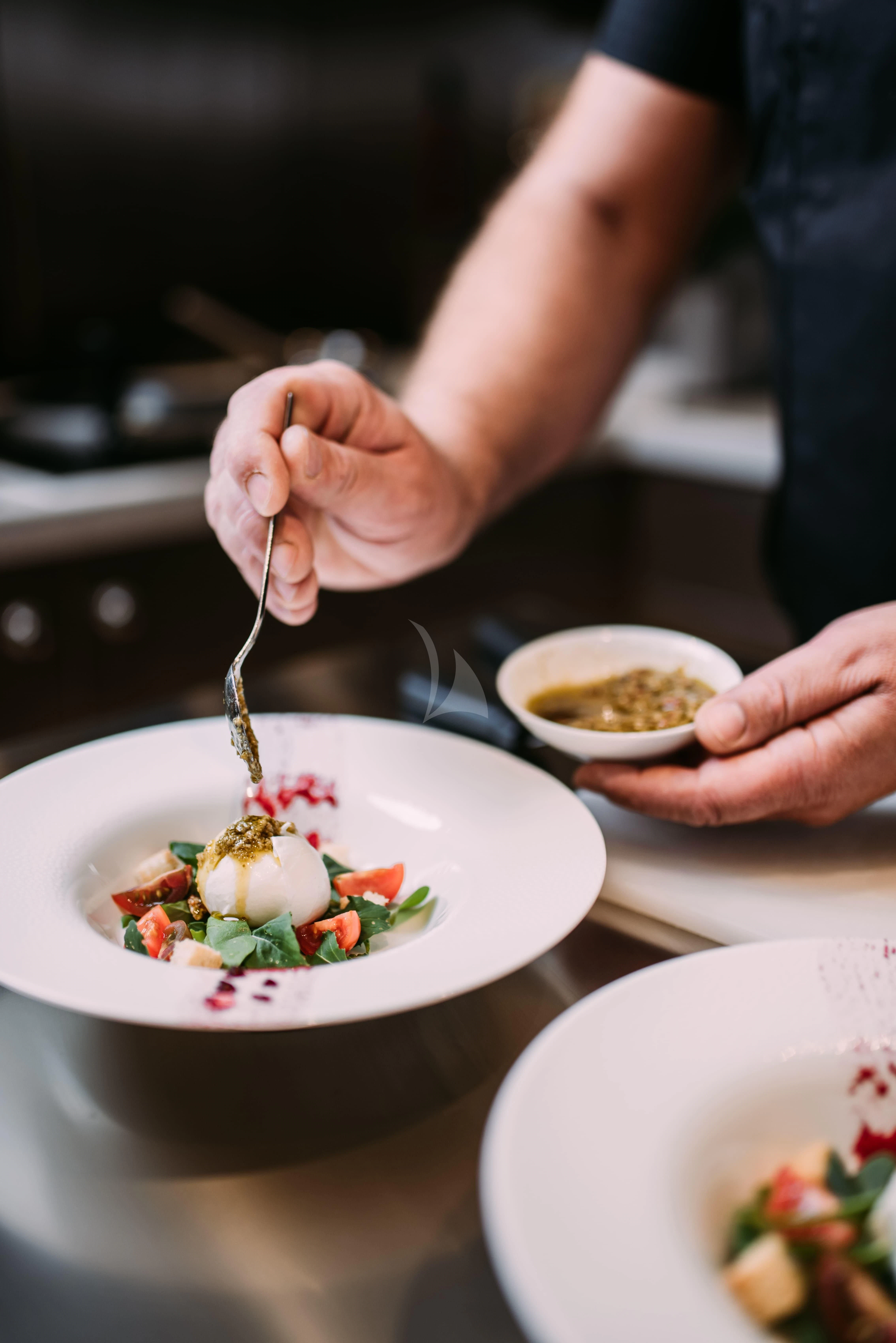 a person eating food aboard TIREA Yacht for Sale