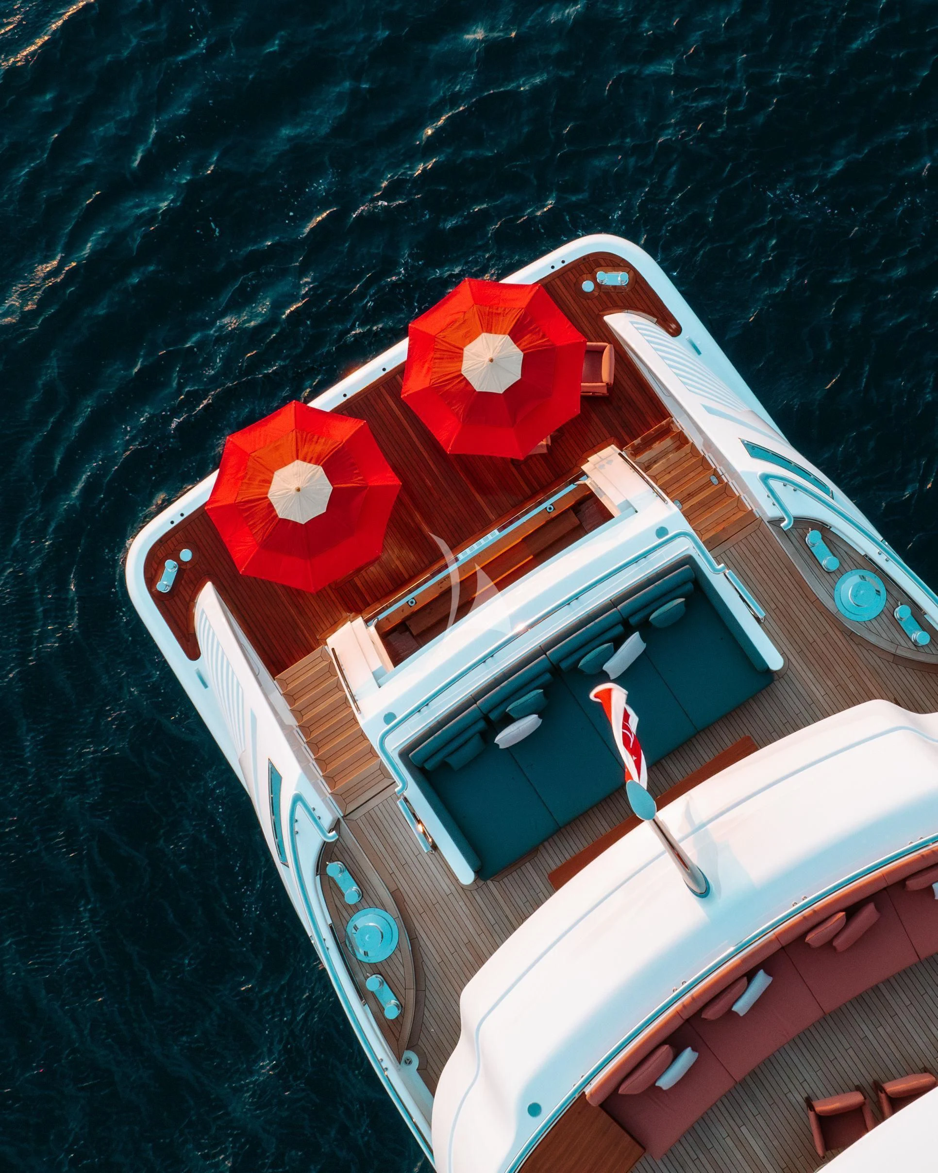 a boat with red sails aboard TIREA Yacht for Sale