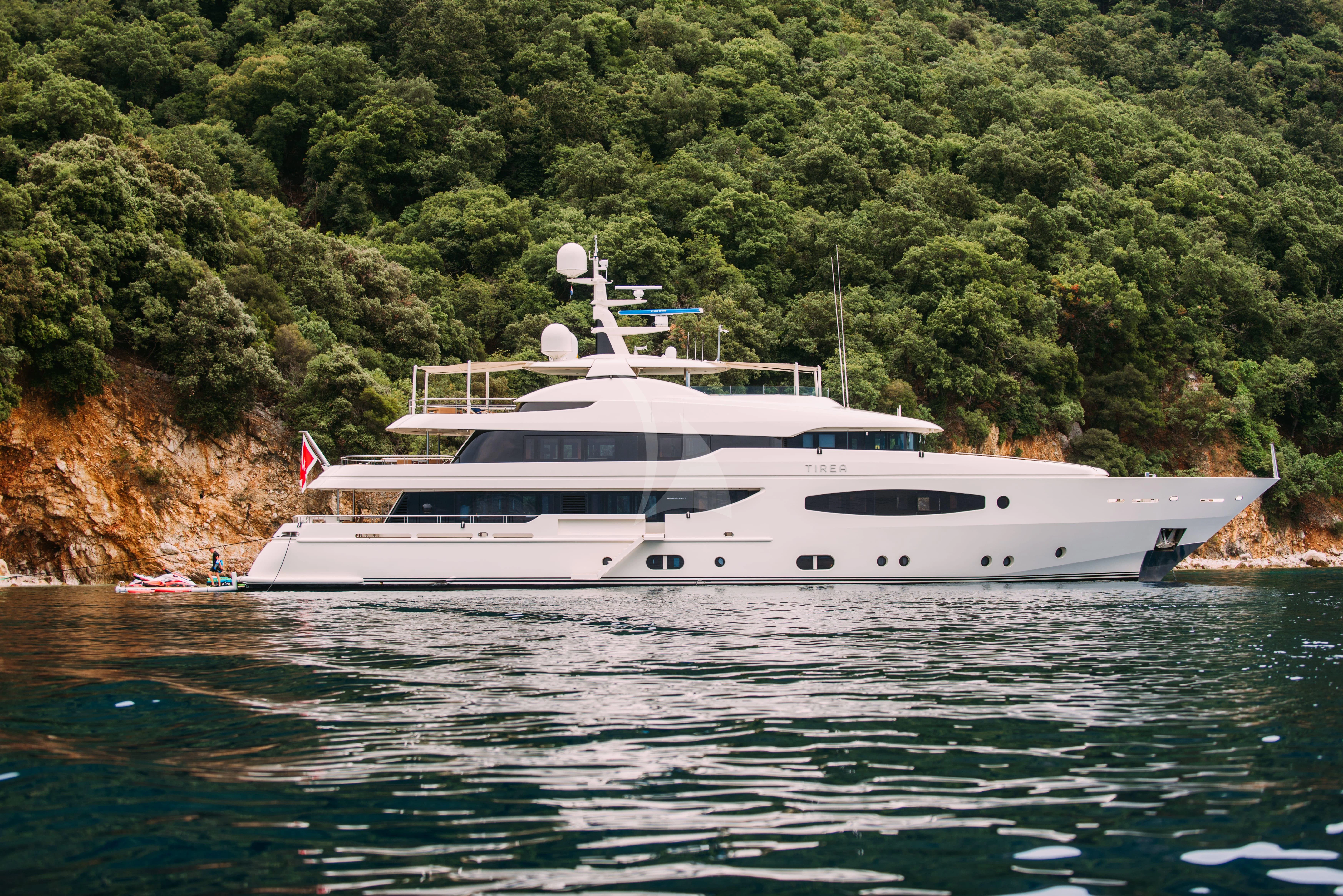 a white yacht on the water aboard TIREA Yacht for Sale