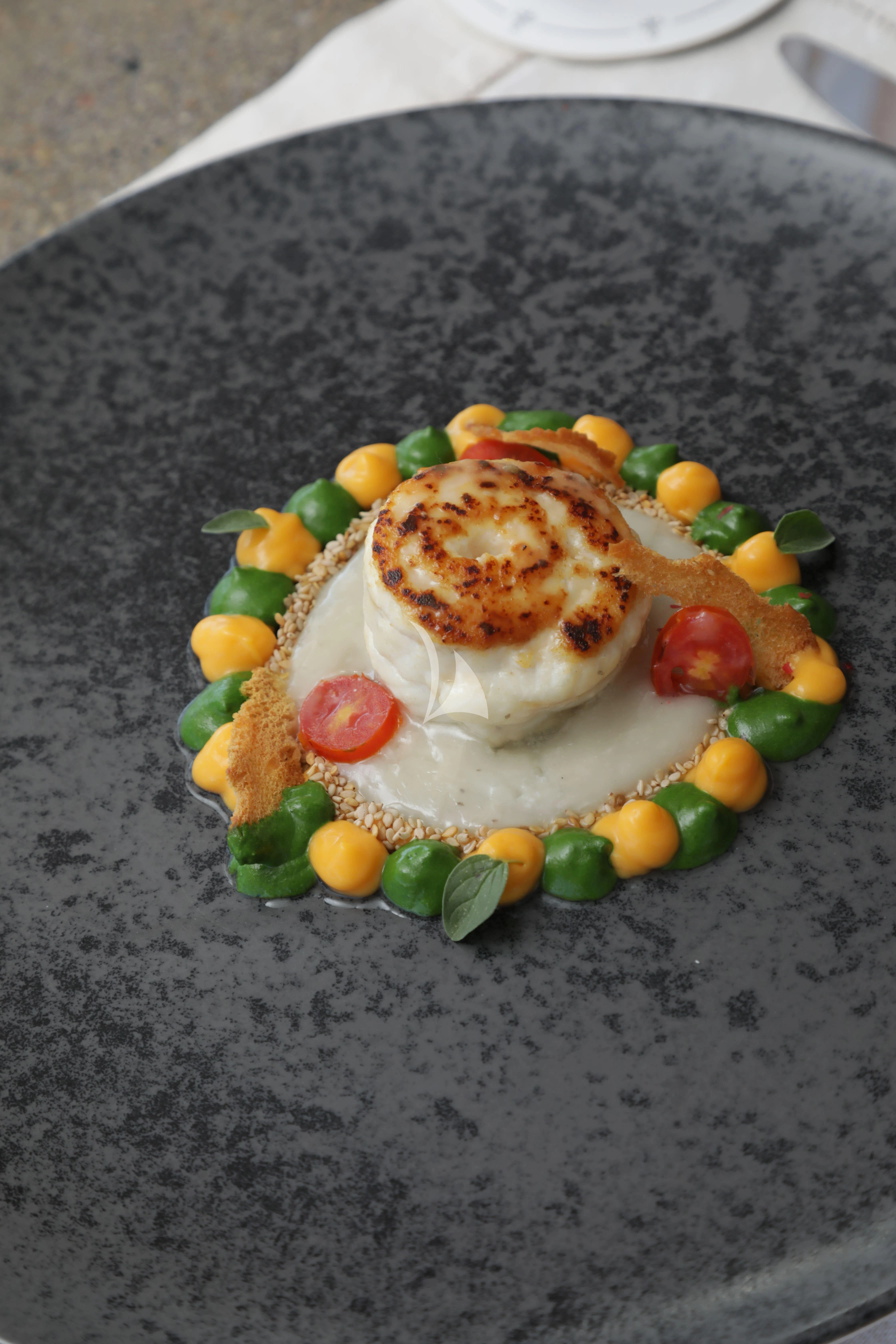 a plate of food aboard TIREA Yacht for Sale