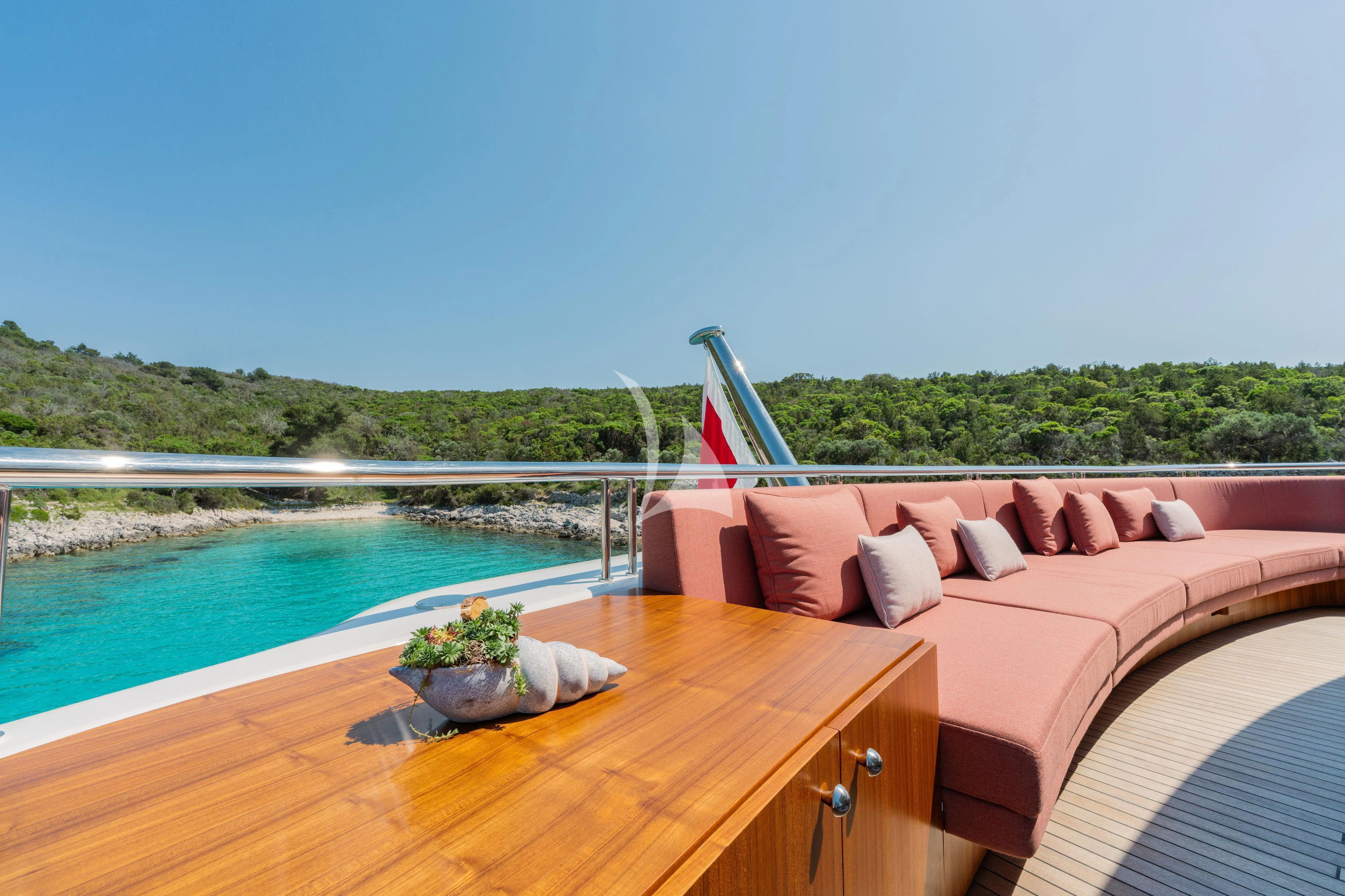 a deck with a pool and a view of the water aboard TIREA Yacht for Sale