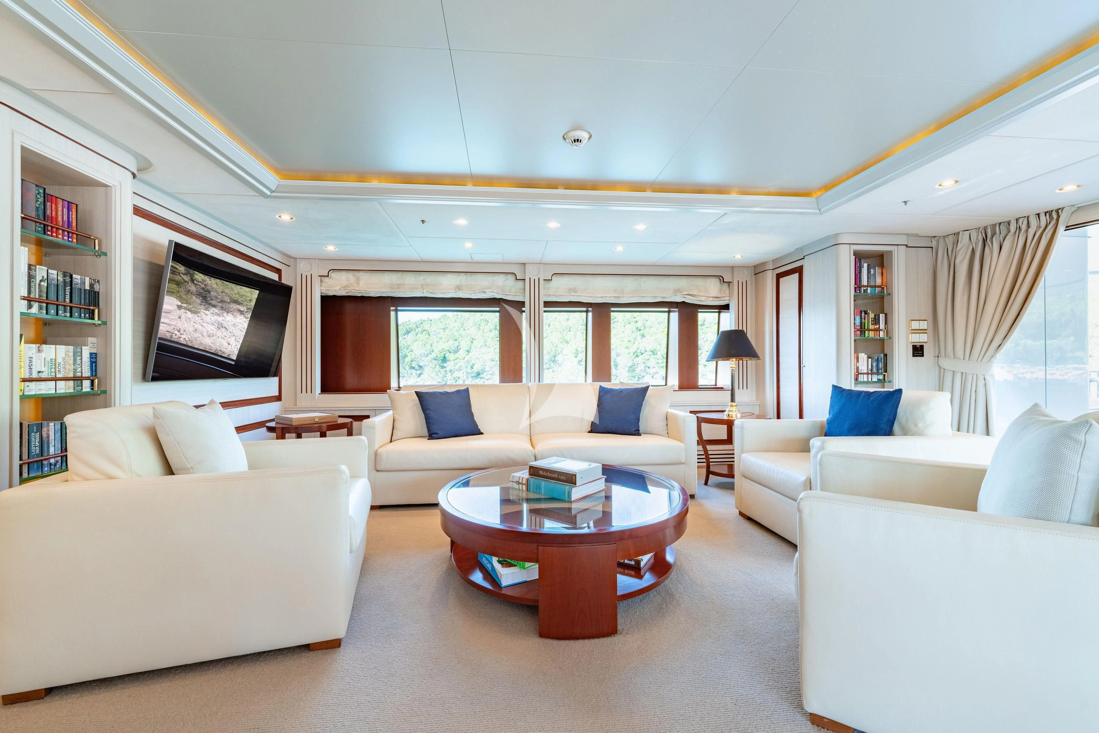 a living room with a couch and a coffee table aboard TIREA Yacht for Sale