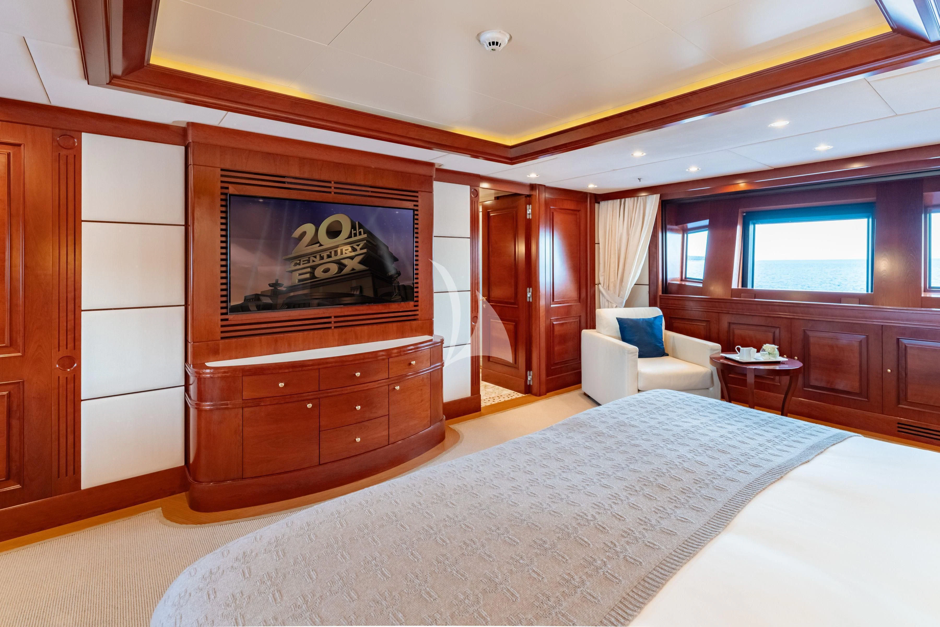 a large bedroom with a large tv aboard TIREA Yacht for Sale