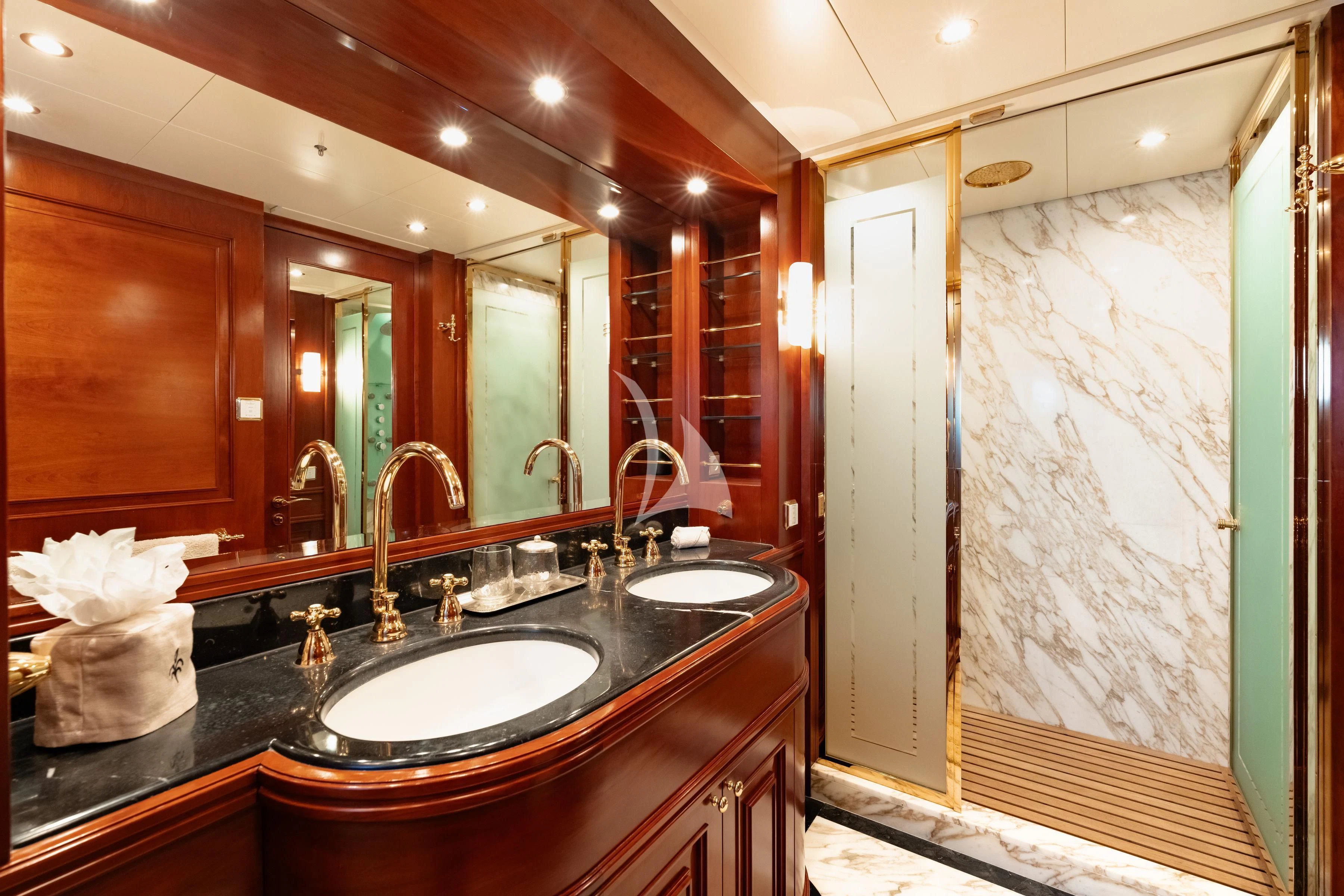 a bathroom with a large mirror aboard TIREA Yacht for Sale