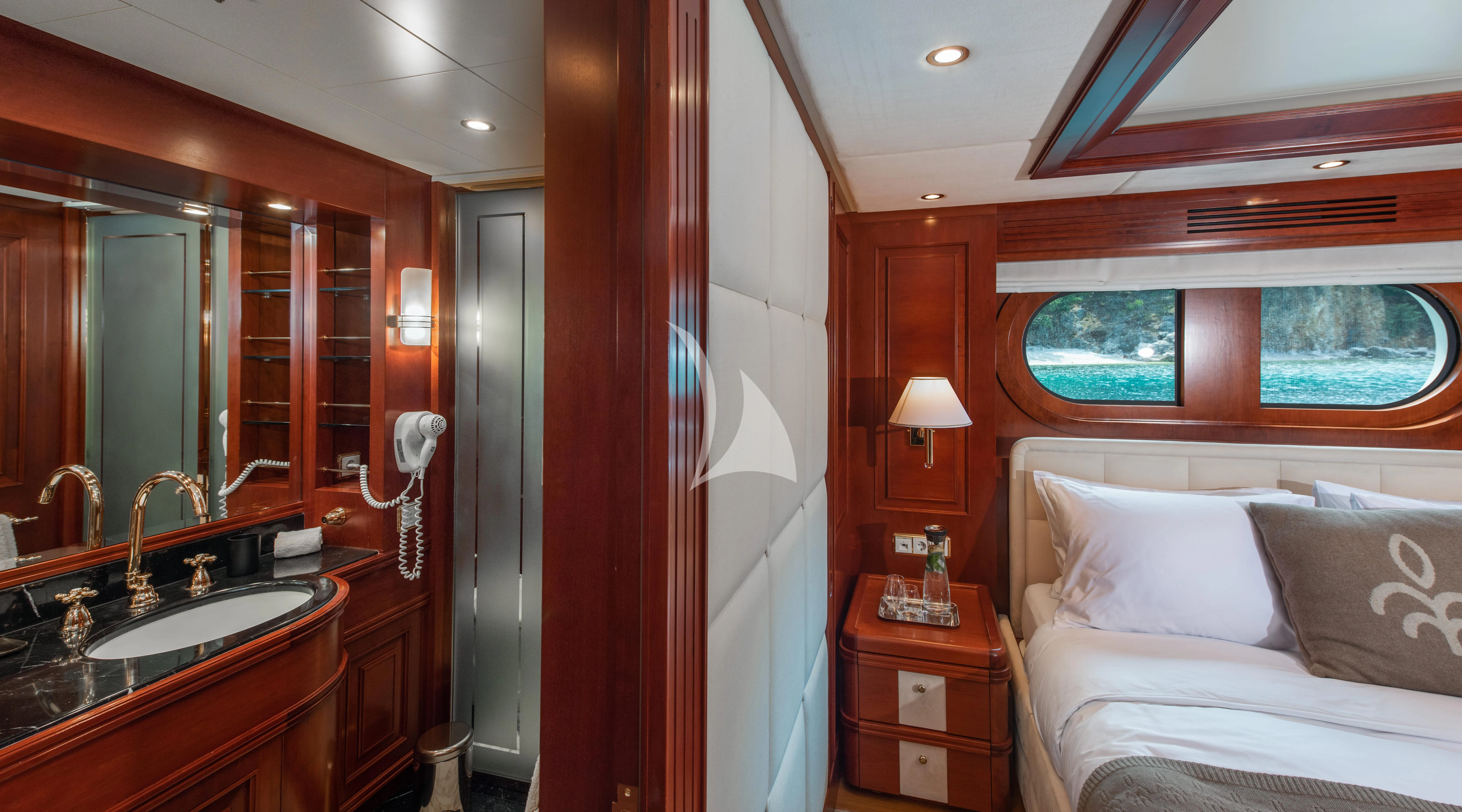 a bedroom with a bed and a sink aboard TIREA Yacht for Sale