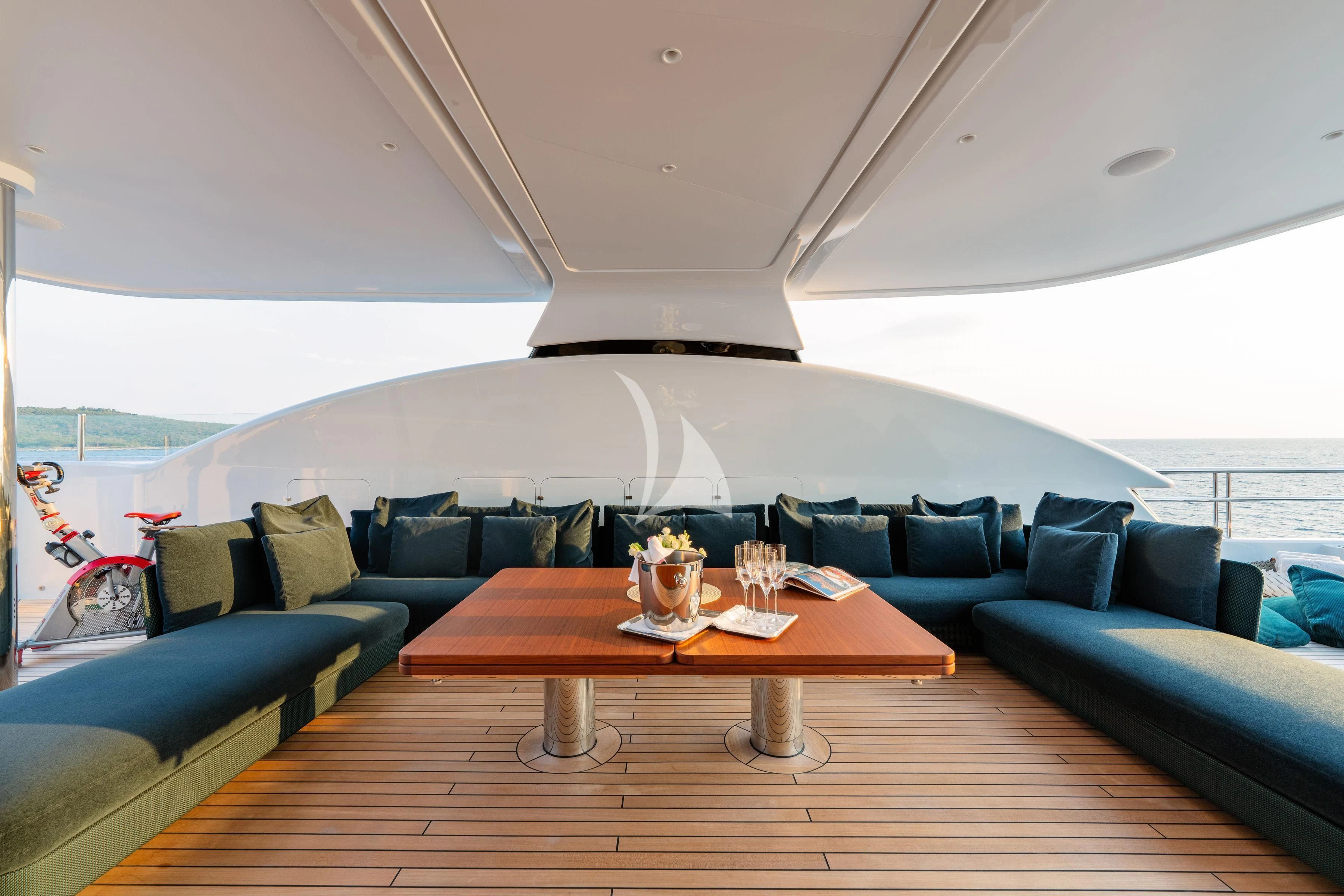 a living room with a couch and a table aboard TIREA Yacht for Sale