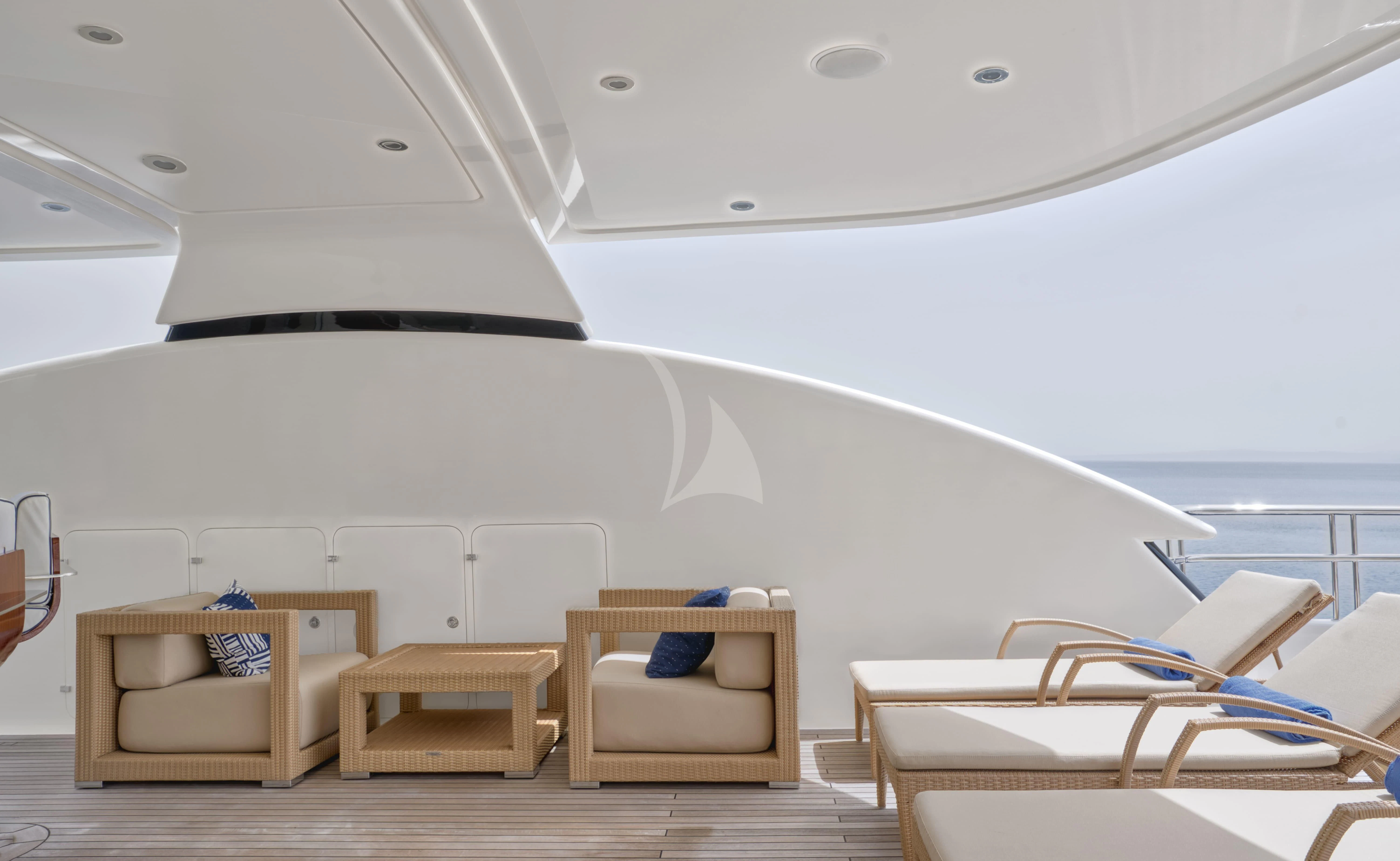 a room with a bed and chairs aboard TIREA Yacht for Sale