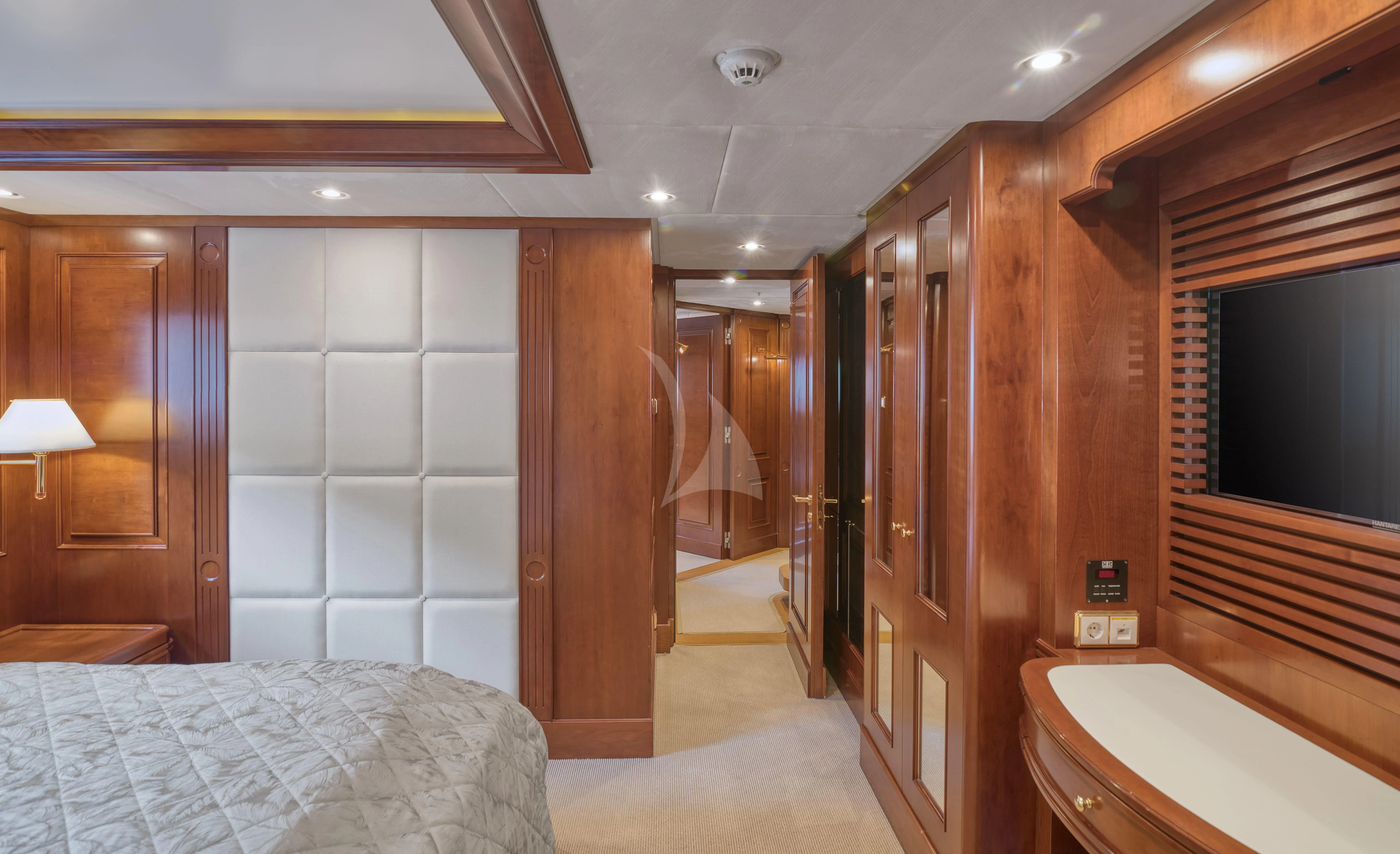 a bedroom with a bed and a closet aboard TIREA Yacht for Sale