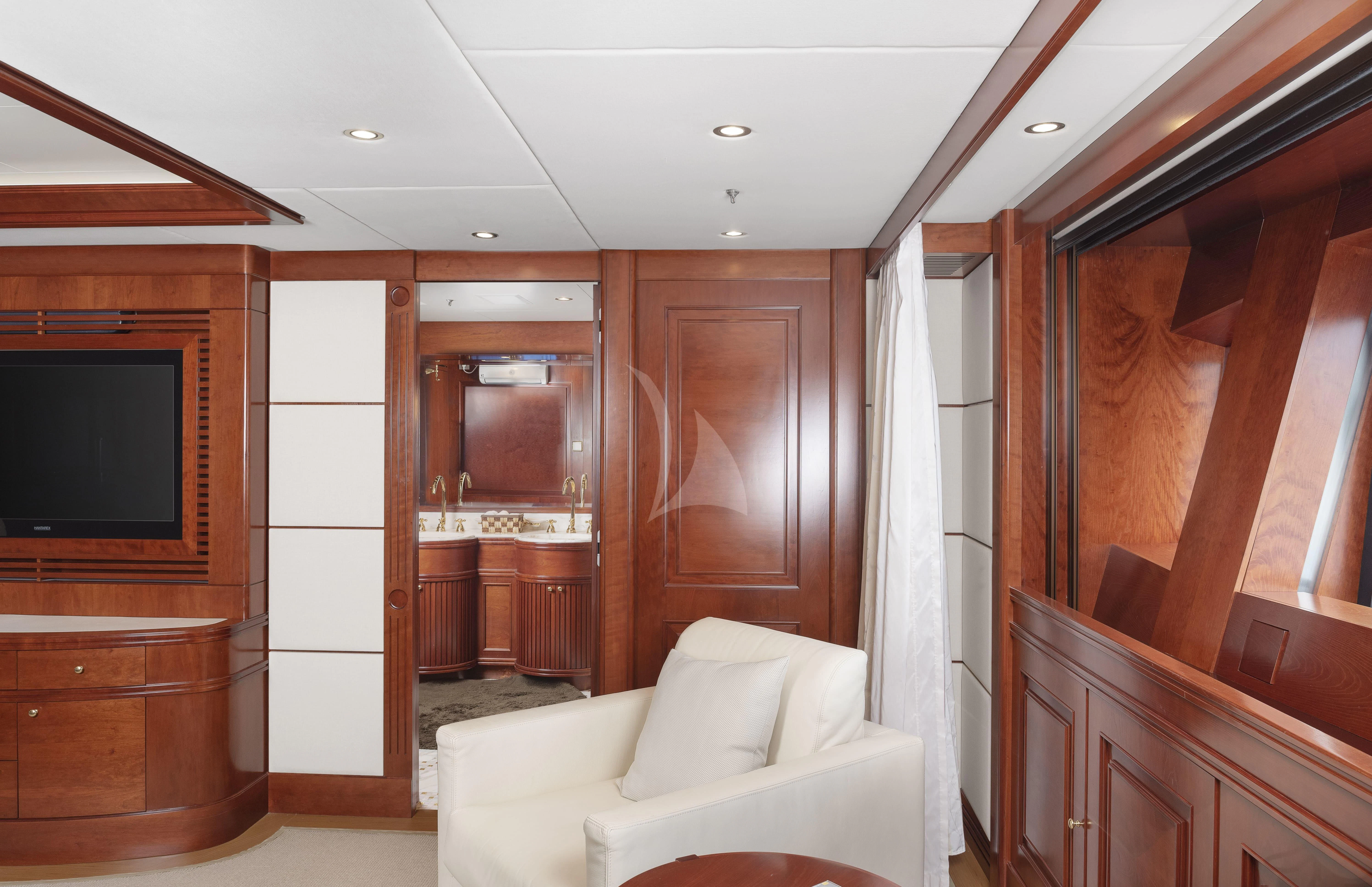 a living room with a white couch aboard TIREA Yacht for Sale
