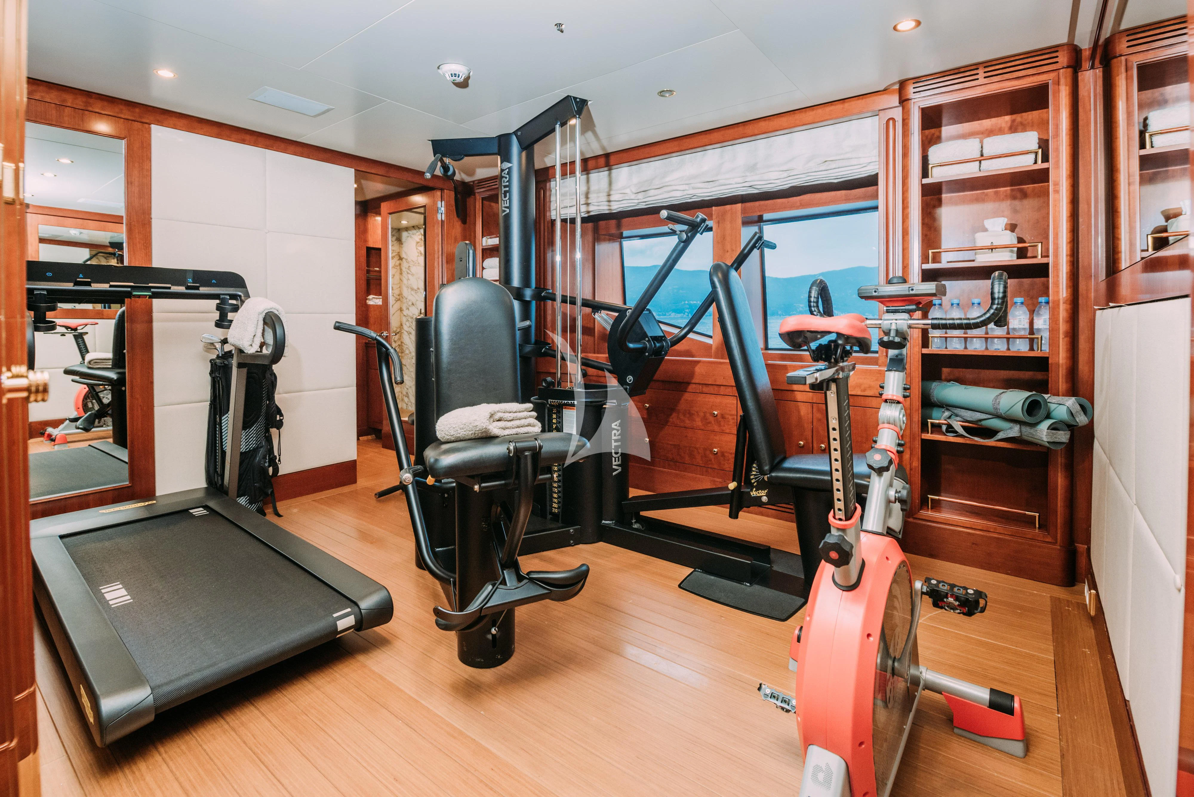 a gym with exercise equipment aboard TIREA Yacht for Sale
