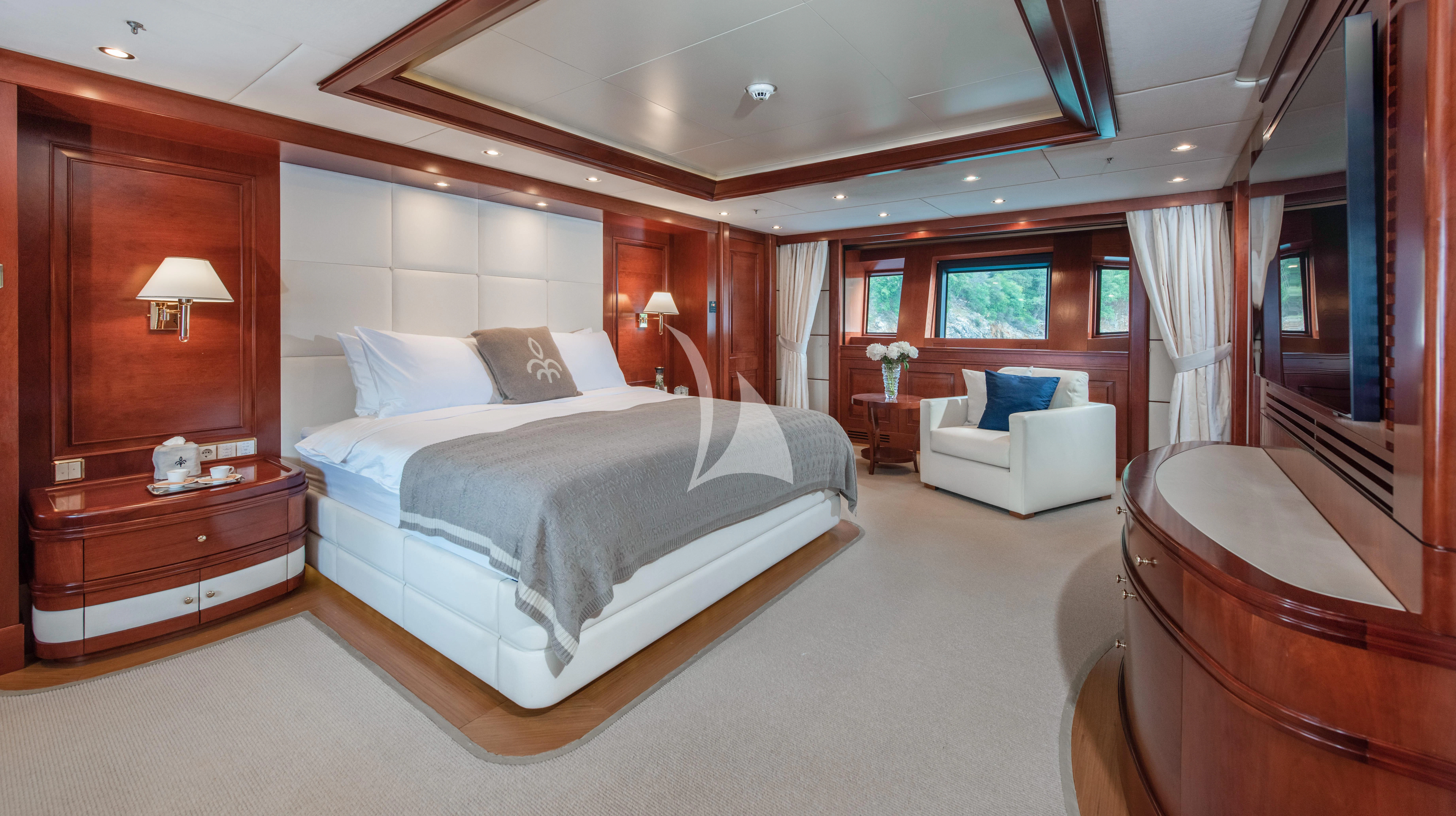 a large bedroom with a bed aboard TIREA Yacht for Sale