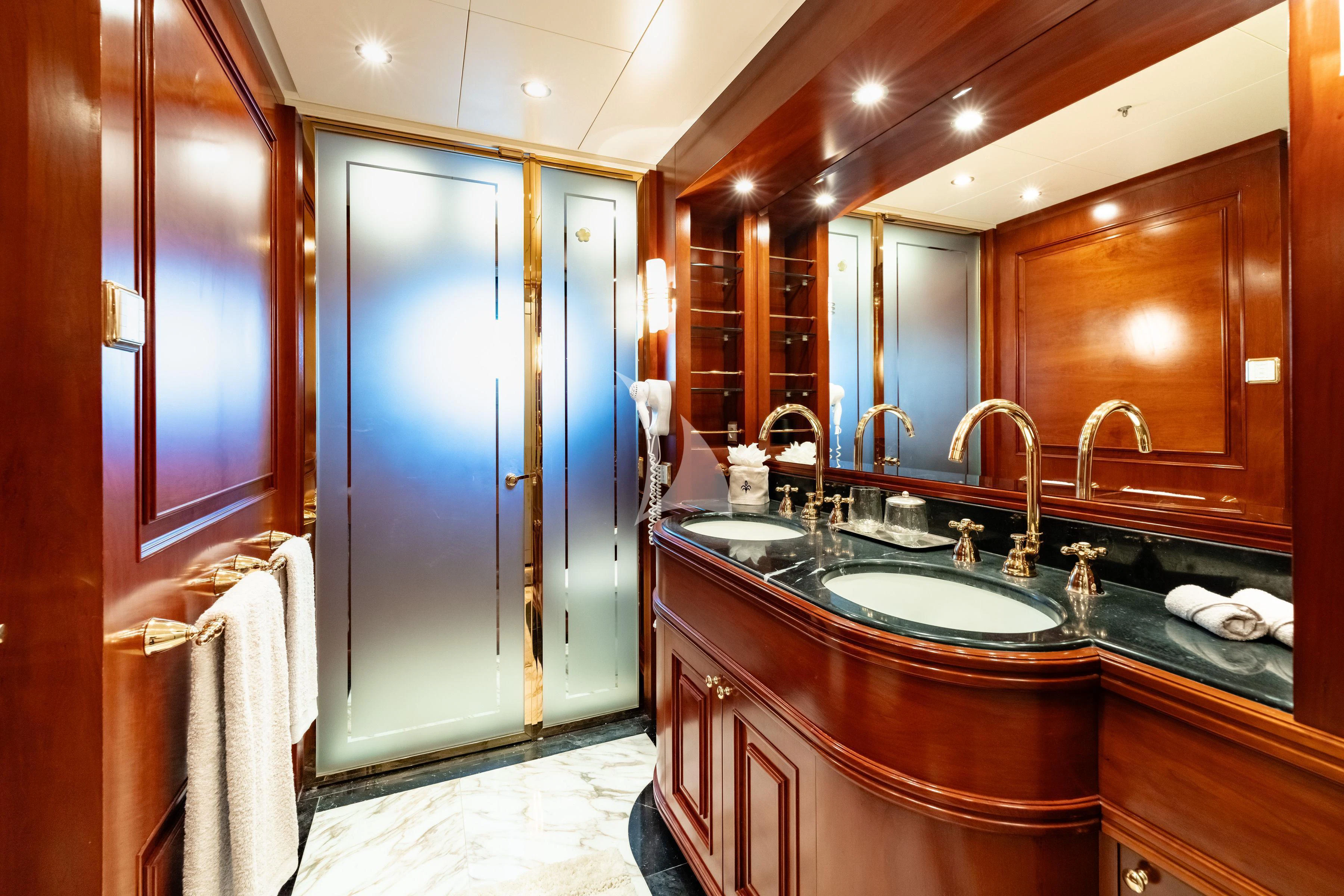 a bathroom with a large mirror aboard TIREA Yacht for Sale