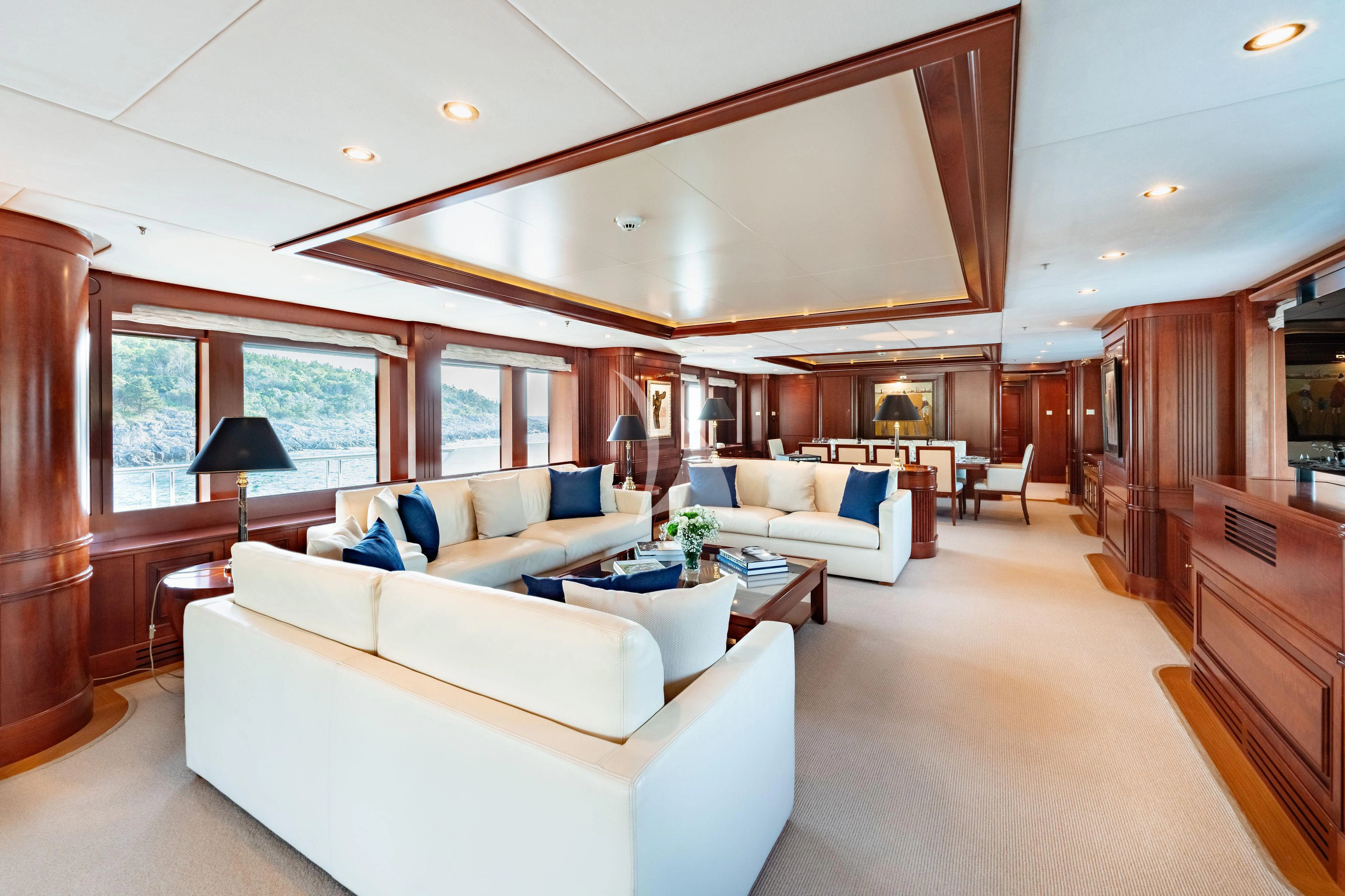 a living room with a couch and a table aboard TIREA Yacht for Sale