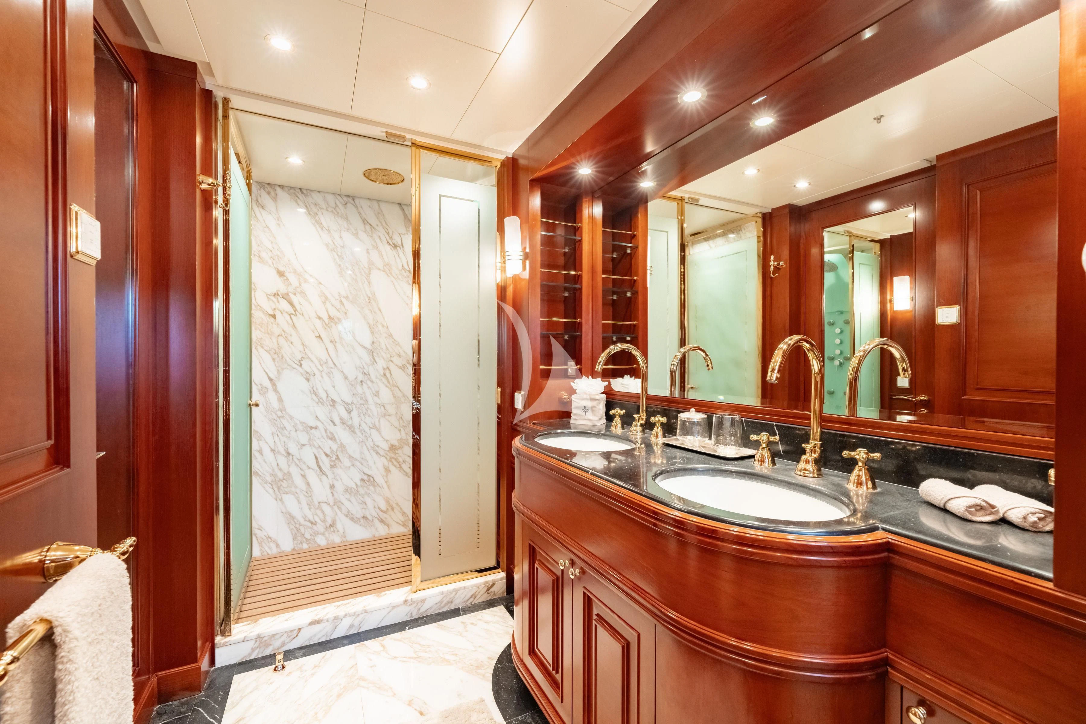 a bathroom with a large mirror aboard TIREA Yacht for Sale