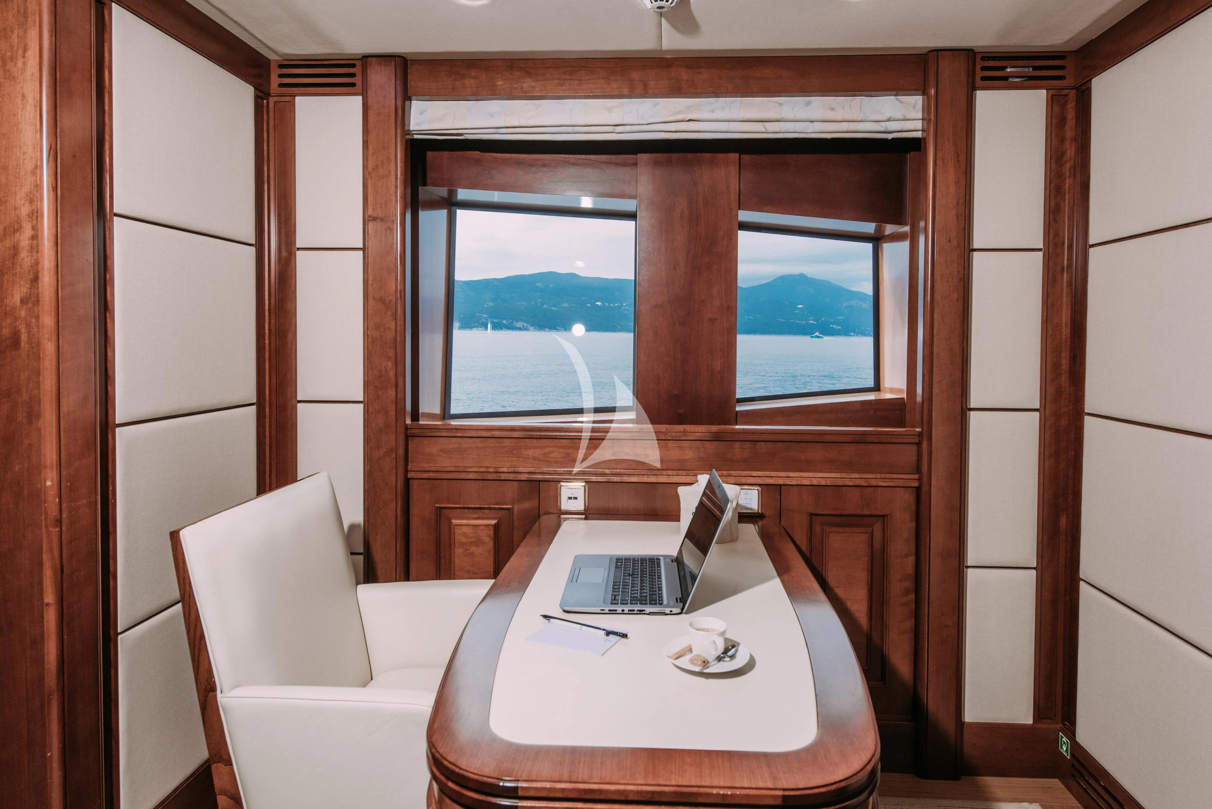 a laptop on a table aboard TIREA Yacht for Sale