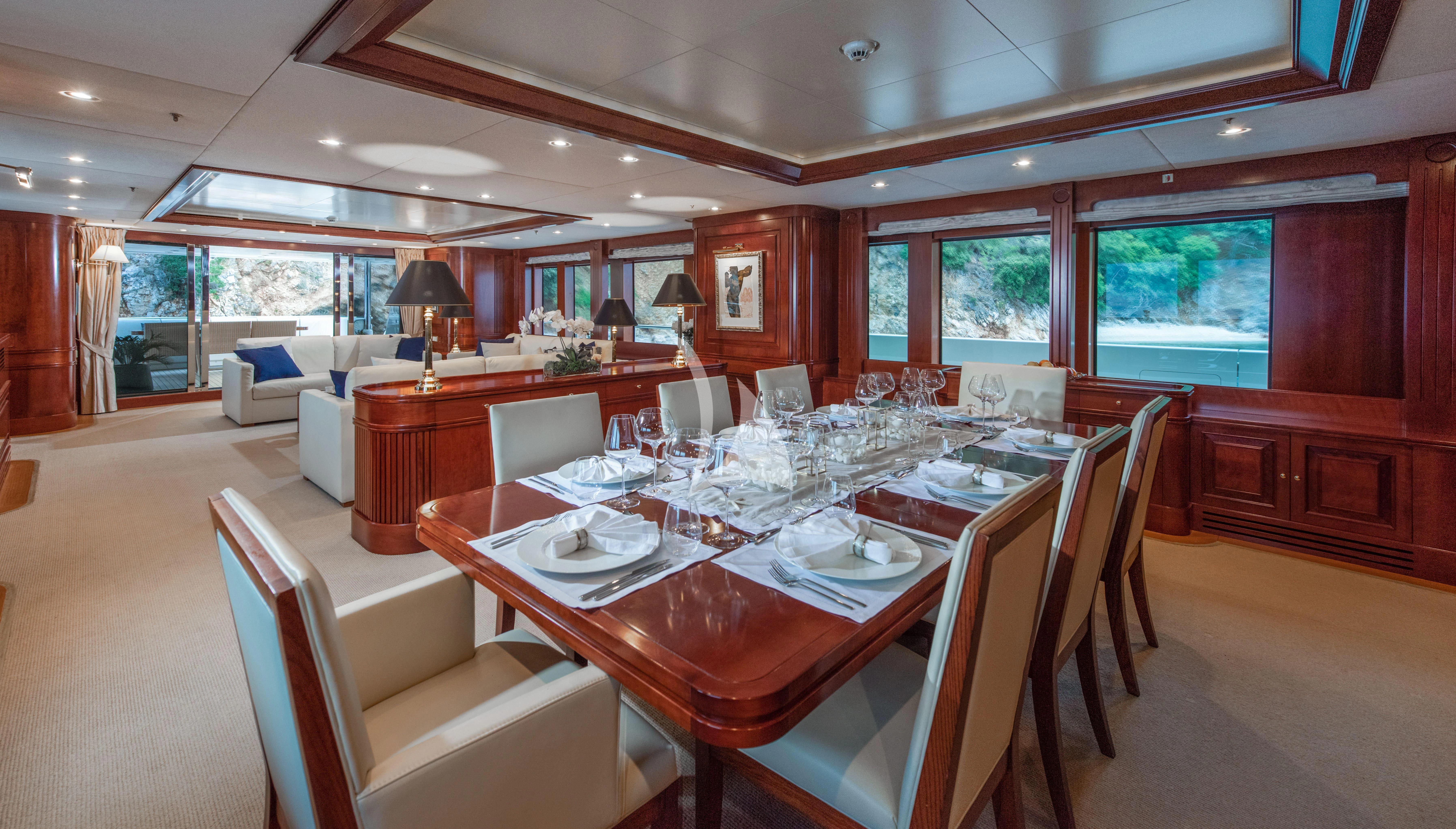 a dining room with a table and chairs aboard TIREA Yacht for Sale