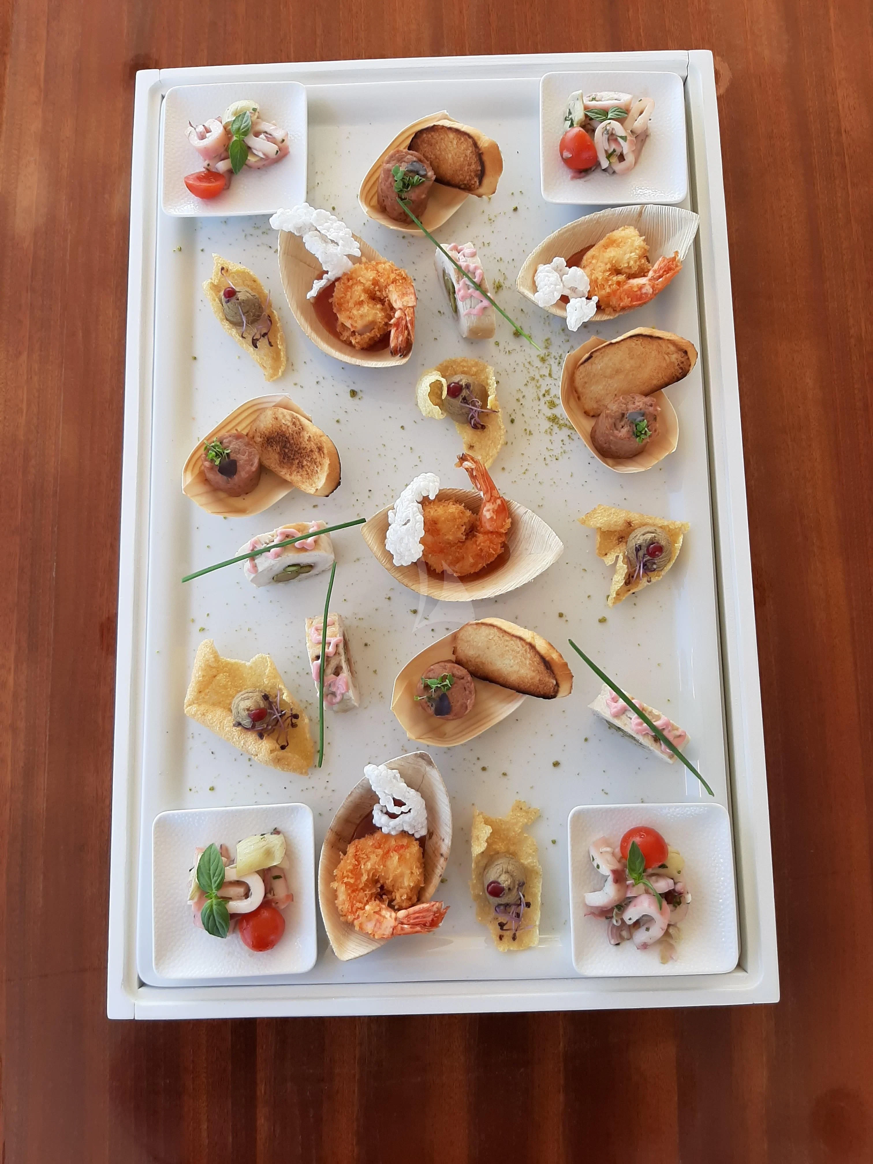 a plate of food aboard TIREA Yacht for Sale