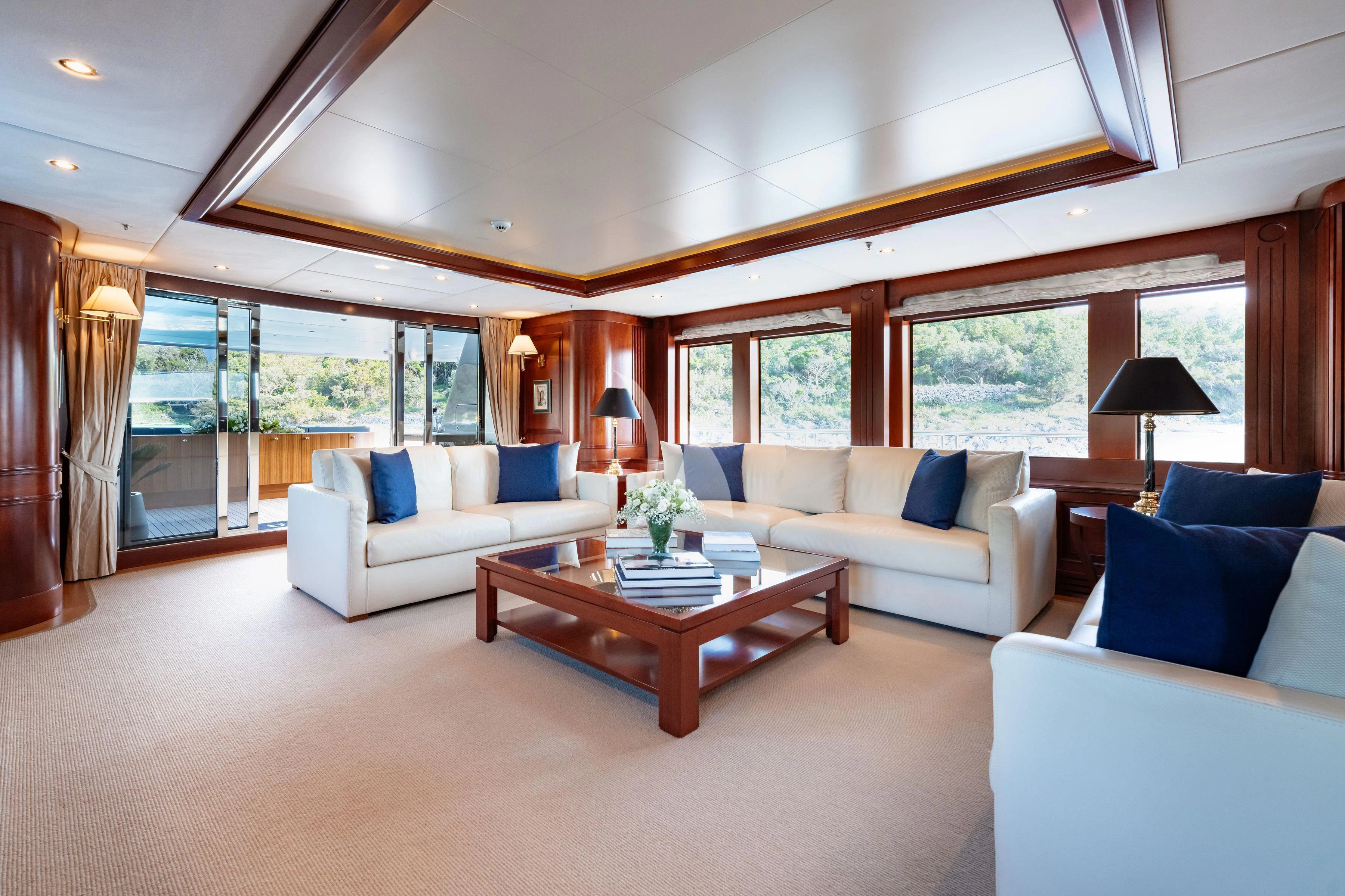 a living room with a large window aboard TIREA Yacht for Sale