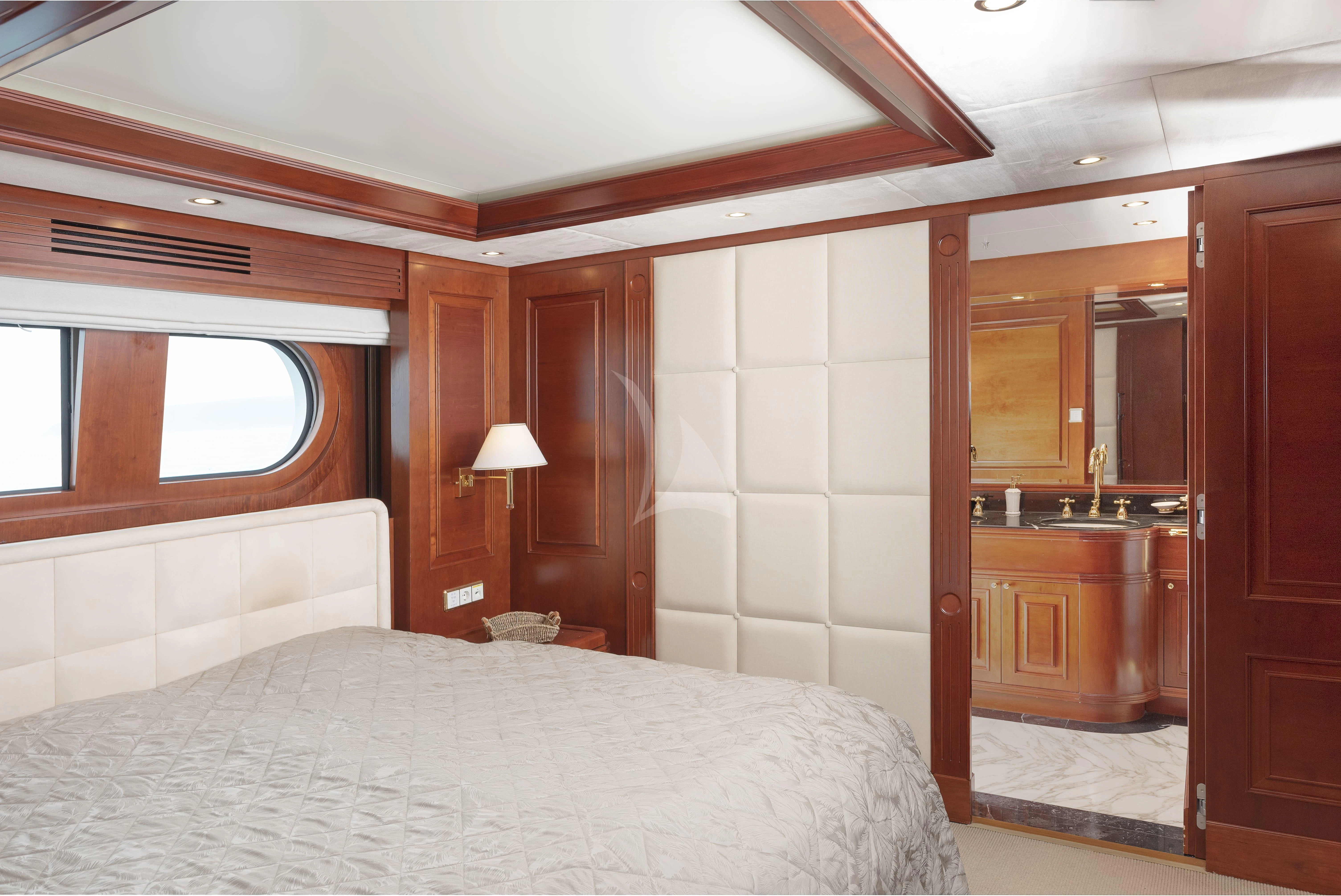 a bedroom with a bed and a sink aboard TIREA Yacht for Sale