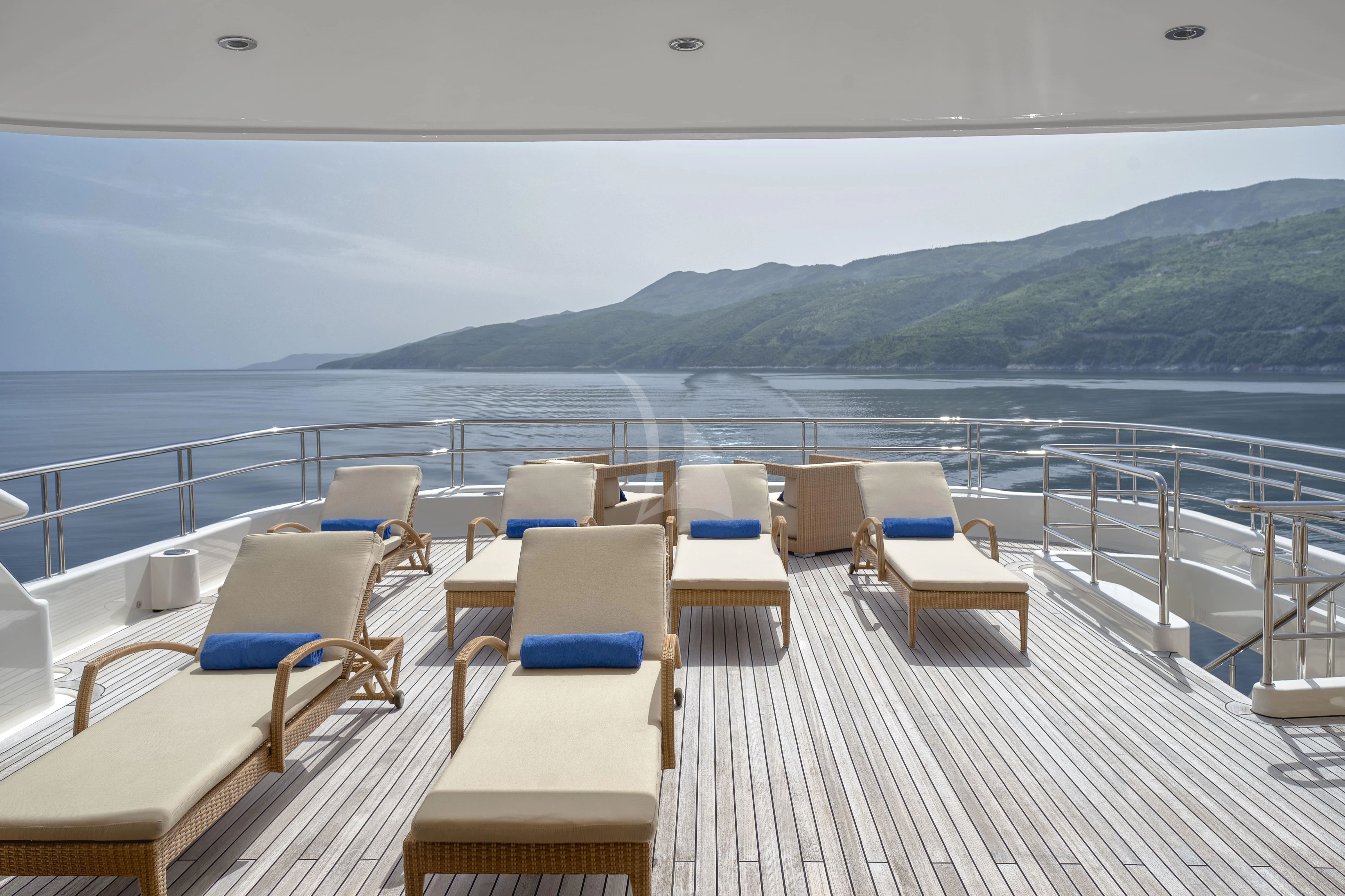 a deck with chairs on it aboard TIREA Yacht for Sale