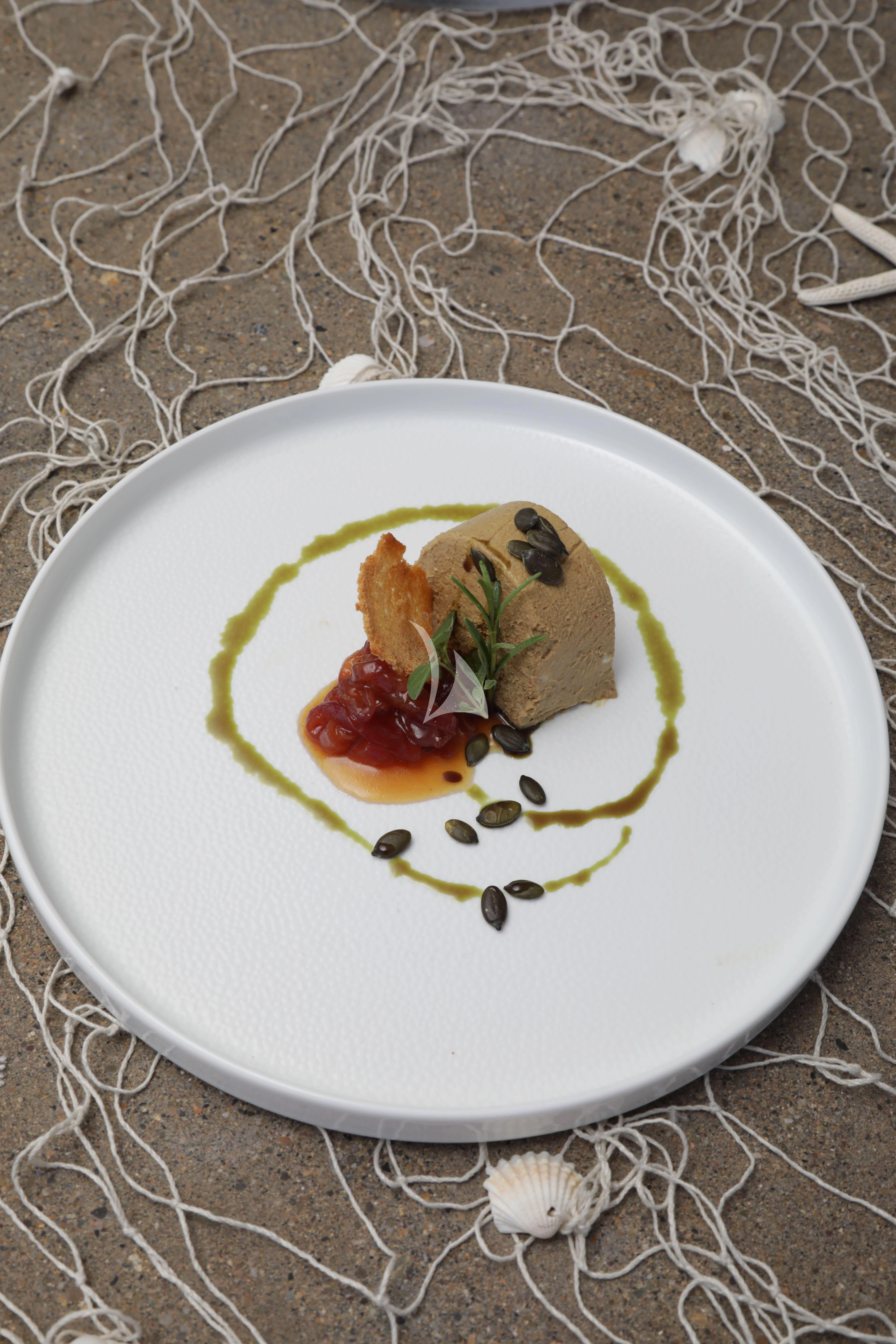 a plate of food aboard TIREA Yacht for Sale
