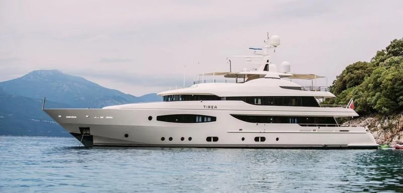 a white yacht on the water aboard TIREA Yacht for Sale