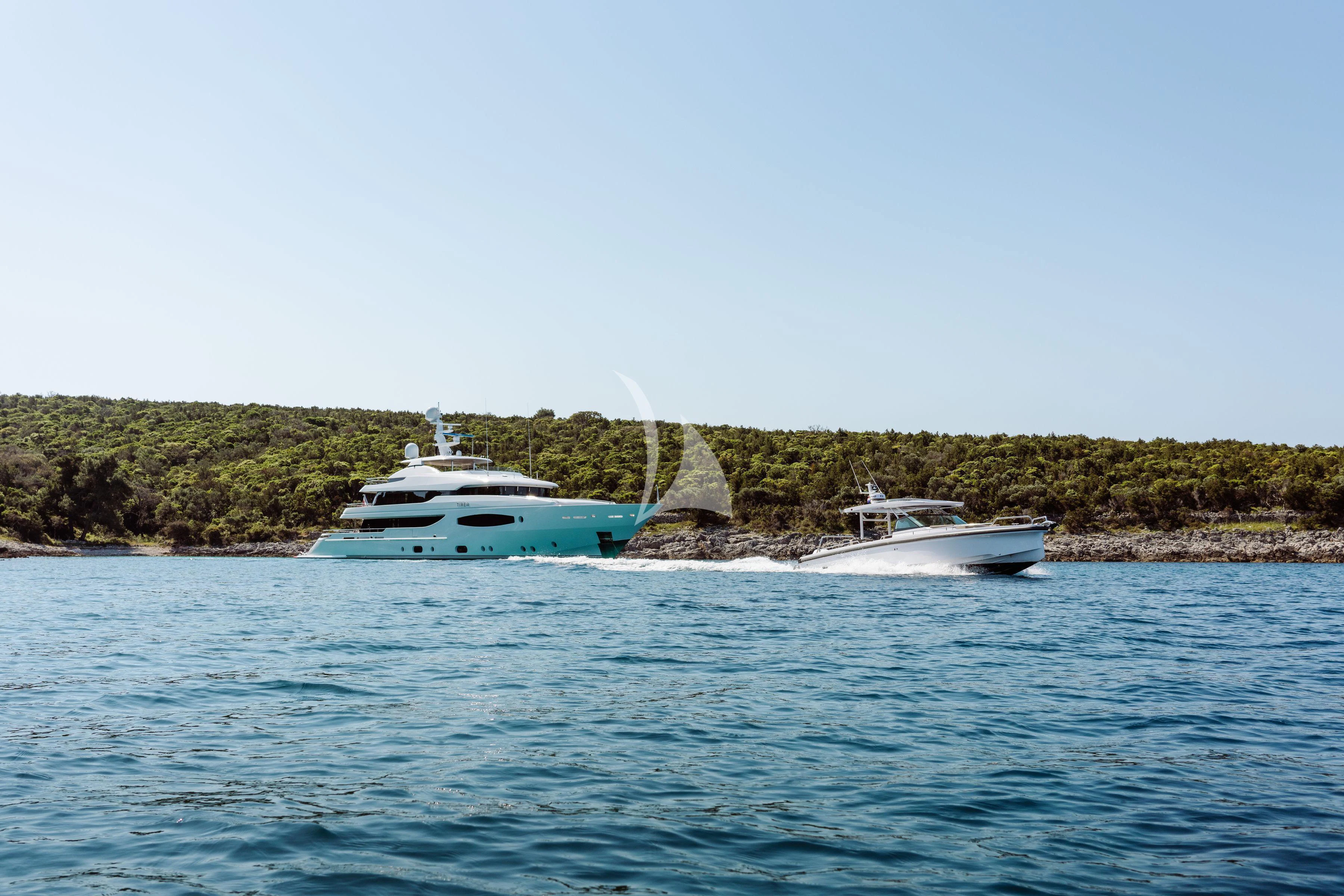 a couple of boats on the water aboard TIREA Yacht for Sale