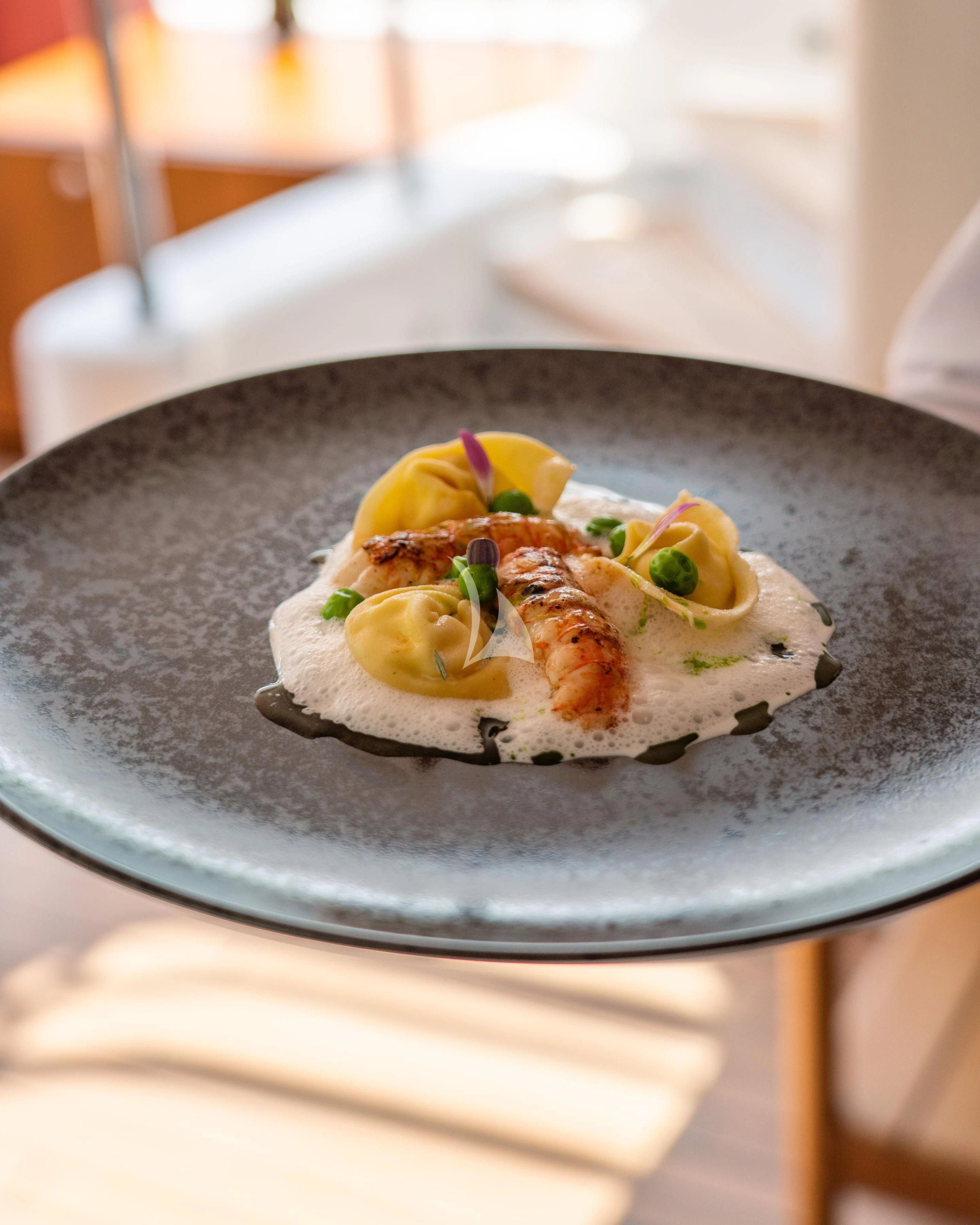 a plate of food aboard TIREA Yacht for Sale