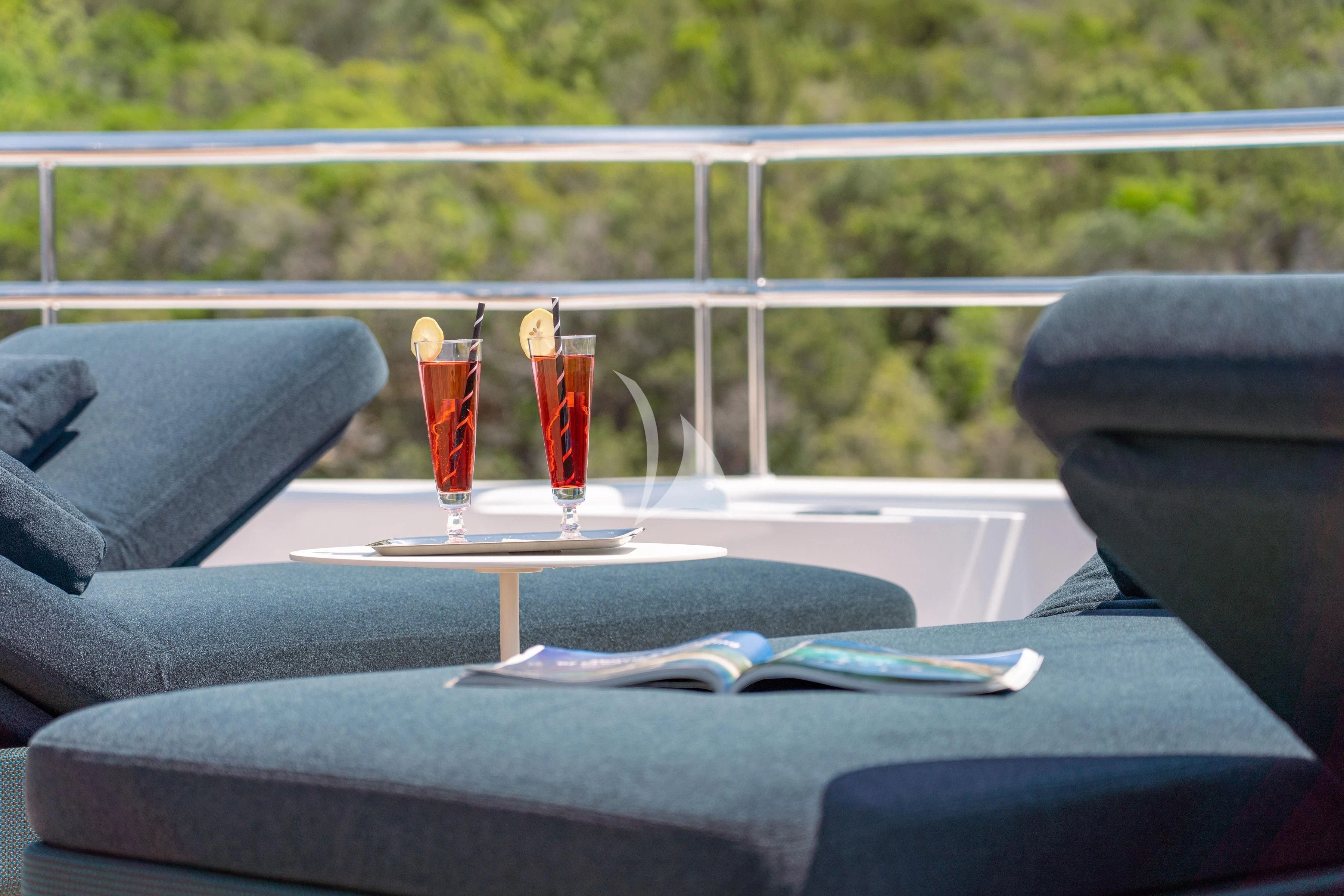 a table with glasses of drinks on it aboard TIREA Yacht for Sale