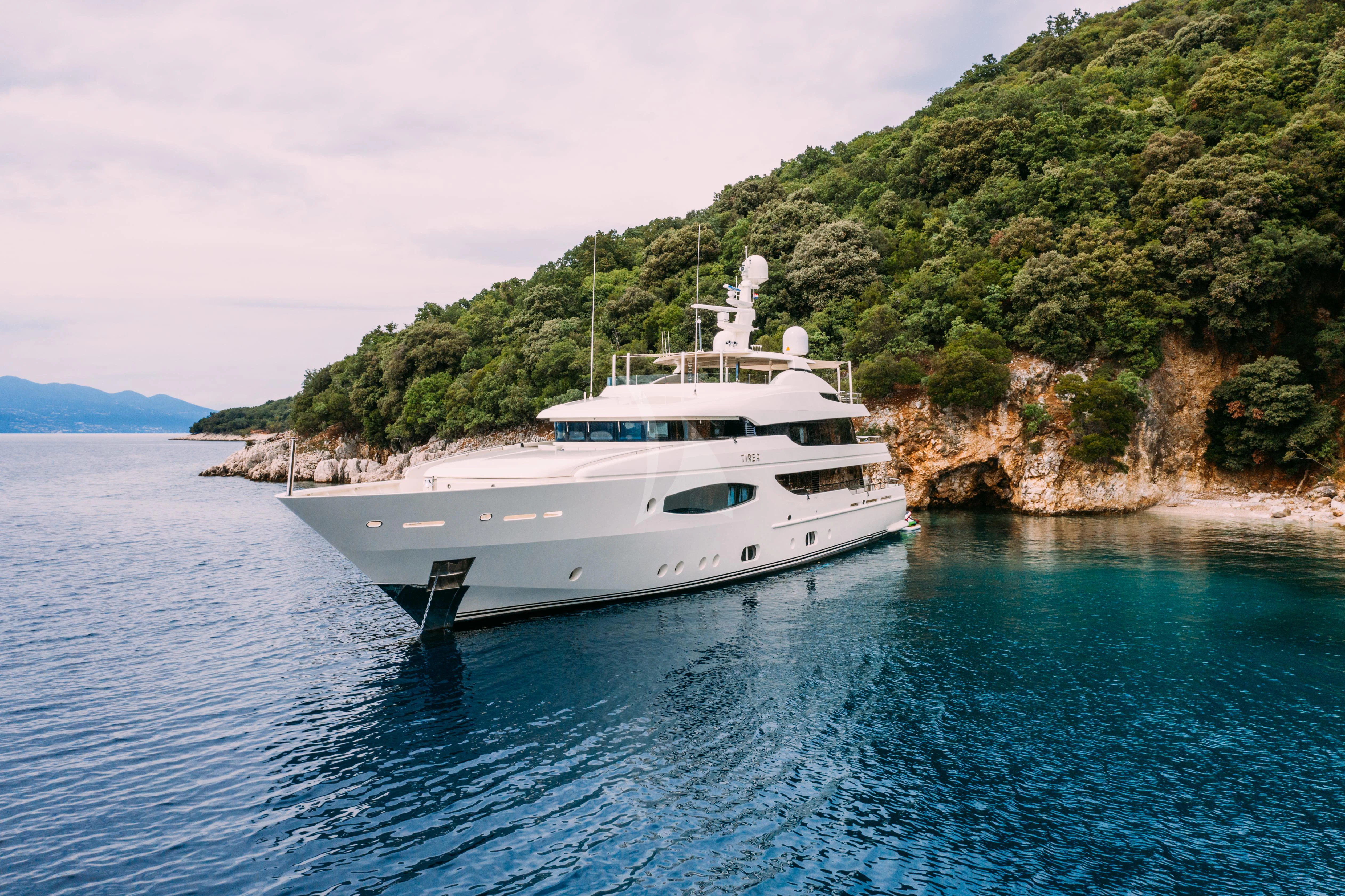 a white boat on the water aboard TIREA Yacht for Sale