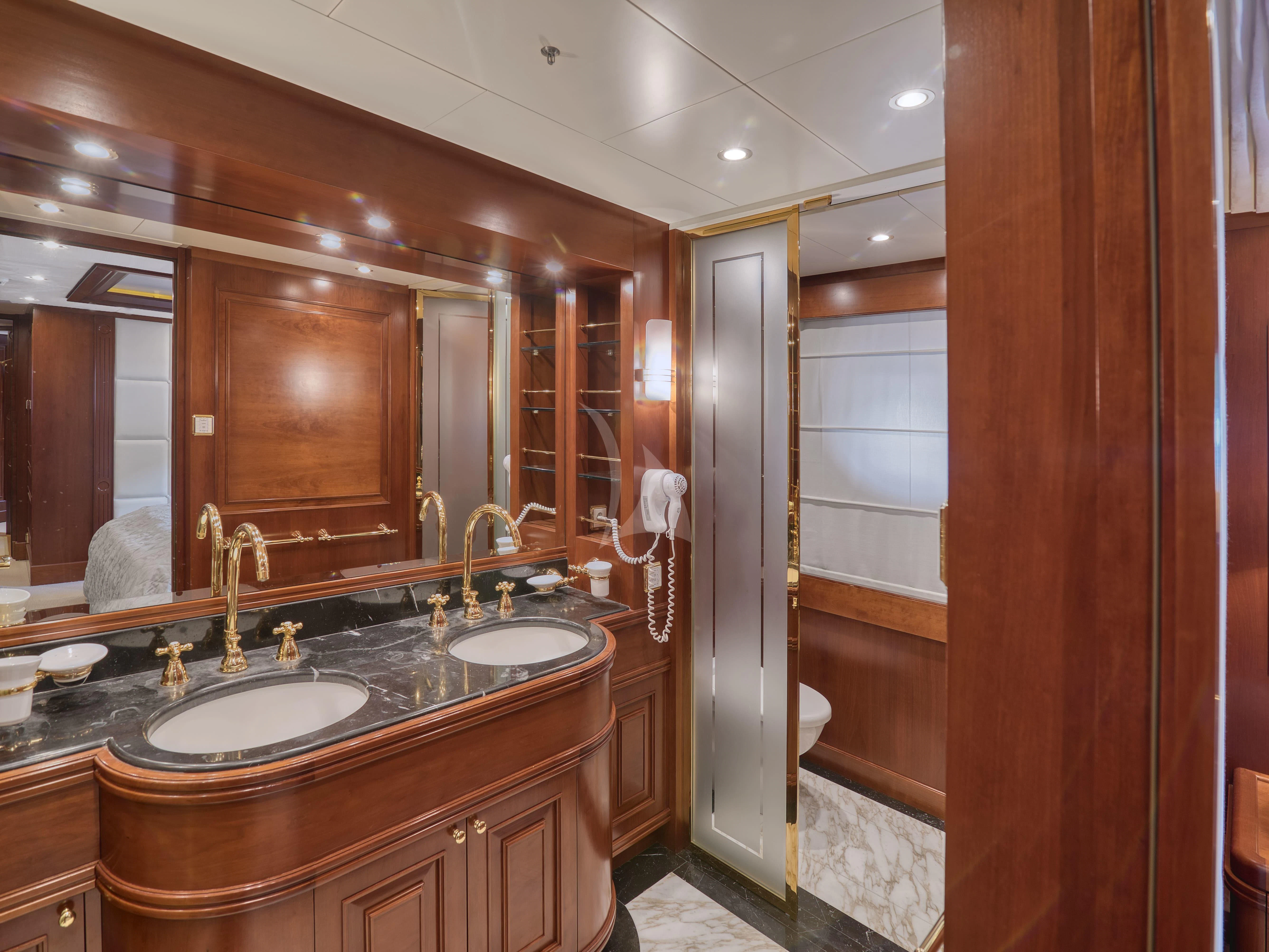 a bathroom with a sink and a mirror aboard TIREA Yacht for Sale