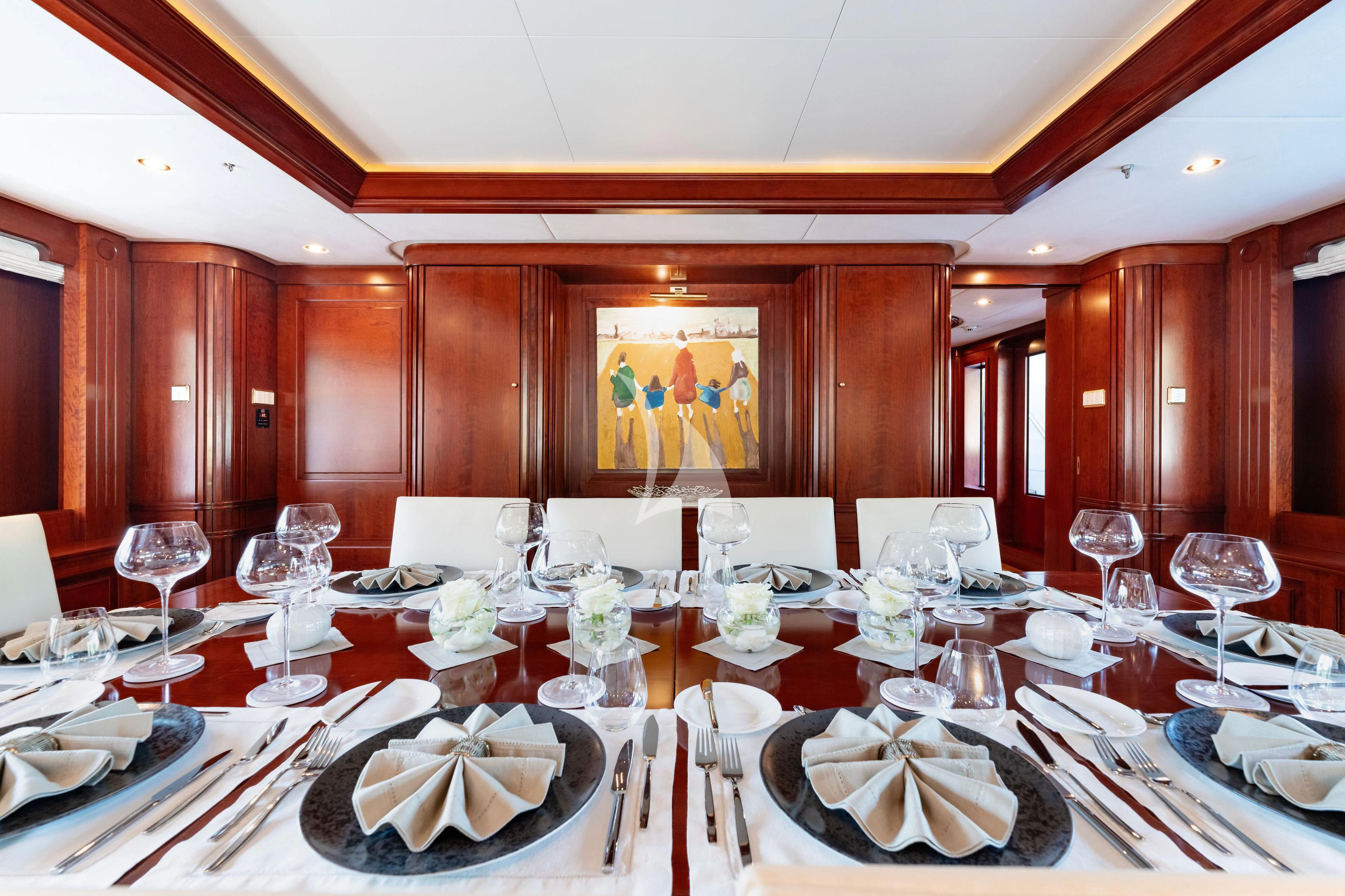 a table set with plates and glasses aboard TIREA Yacht for Sale