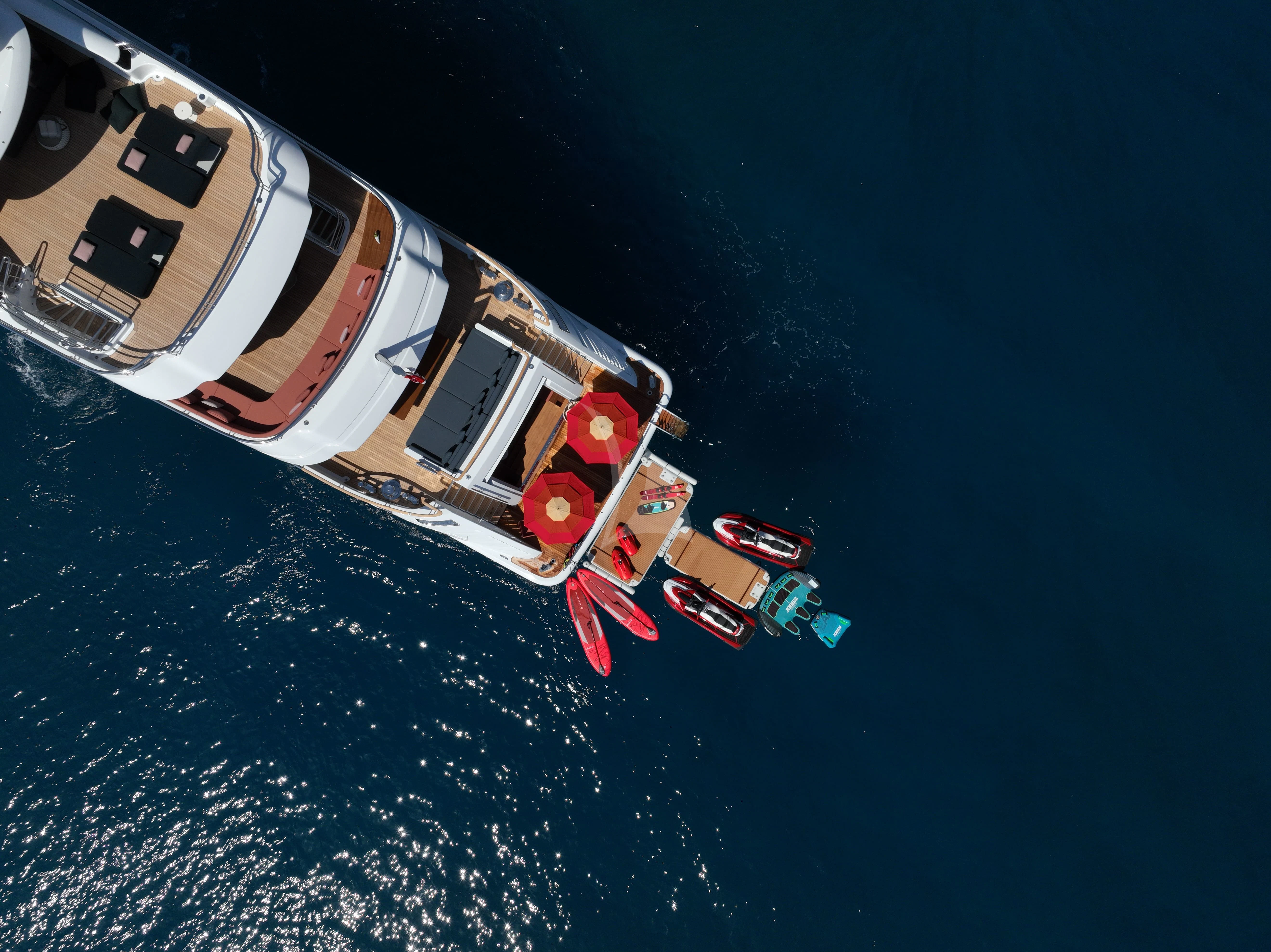 a house with a red roof and a red roof on a blue day aboard TIREA Yacht for Sale