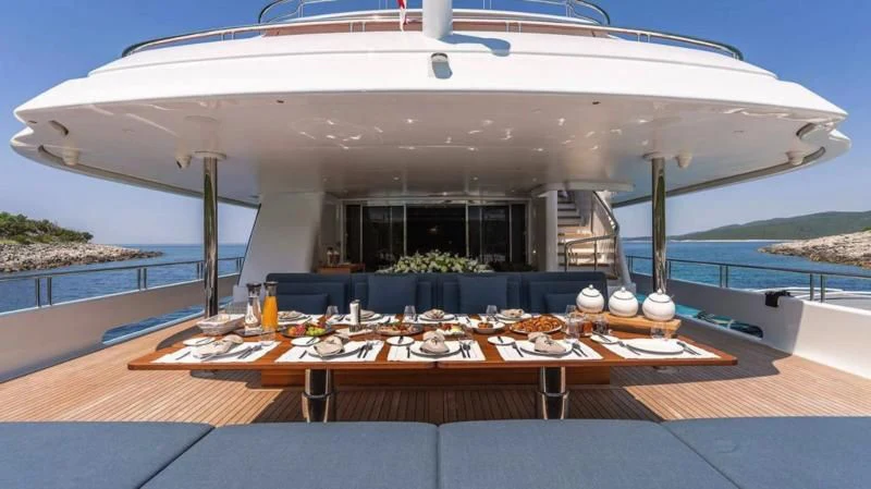 a large white boat on a deck aboard TIREA Yacht for Sale